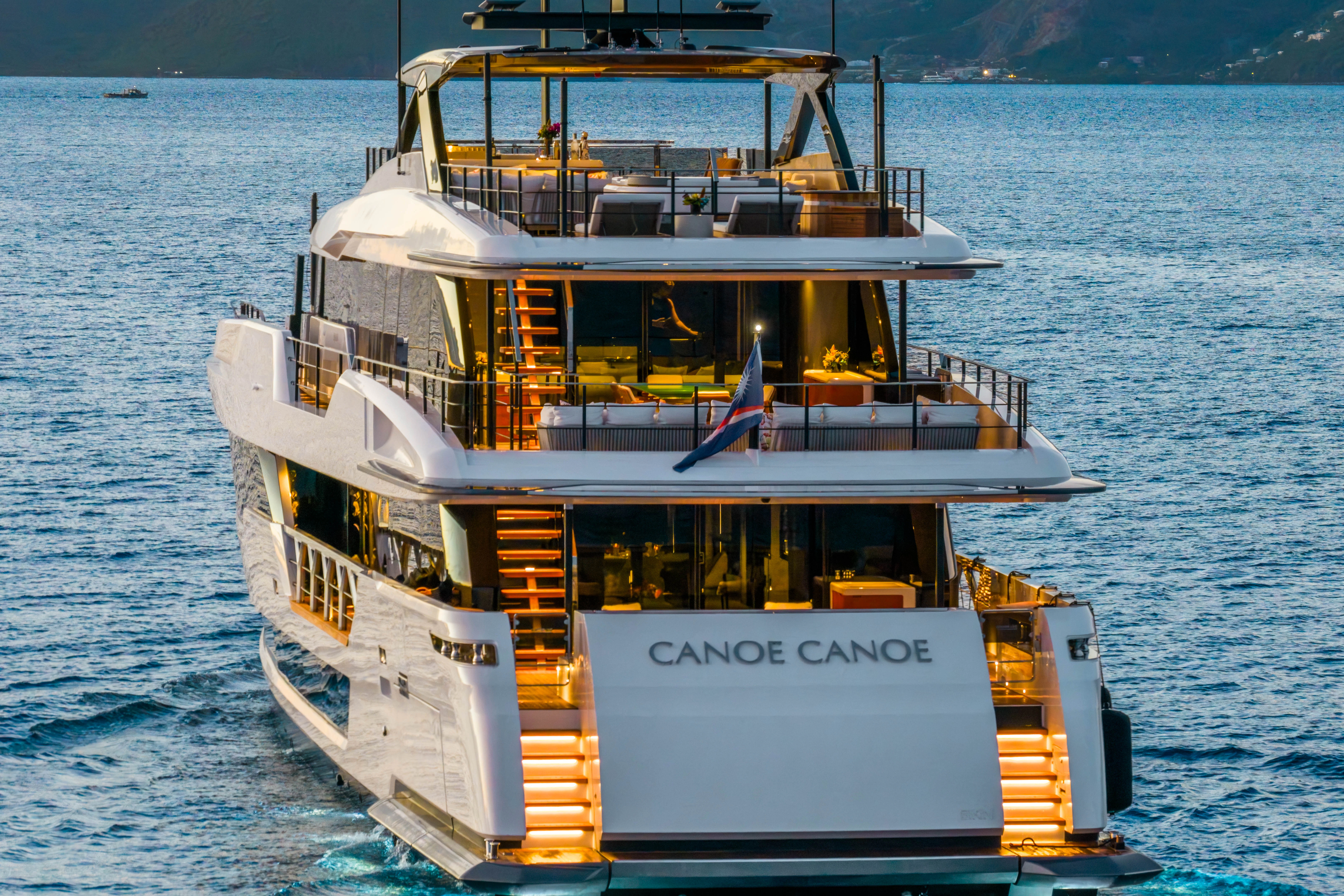 a large white boat in the water aboard CANOE CANOE Yacht for Charter