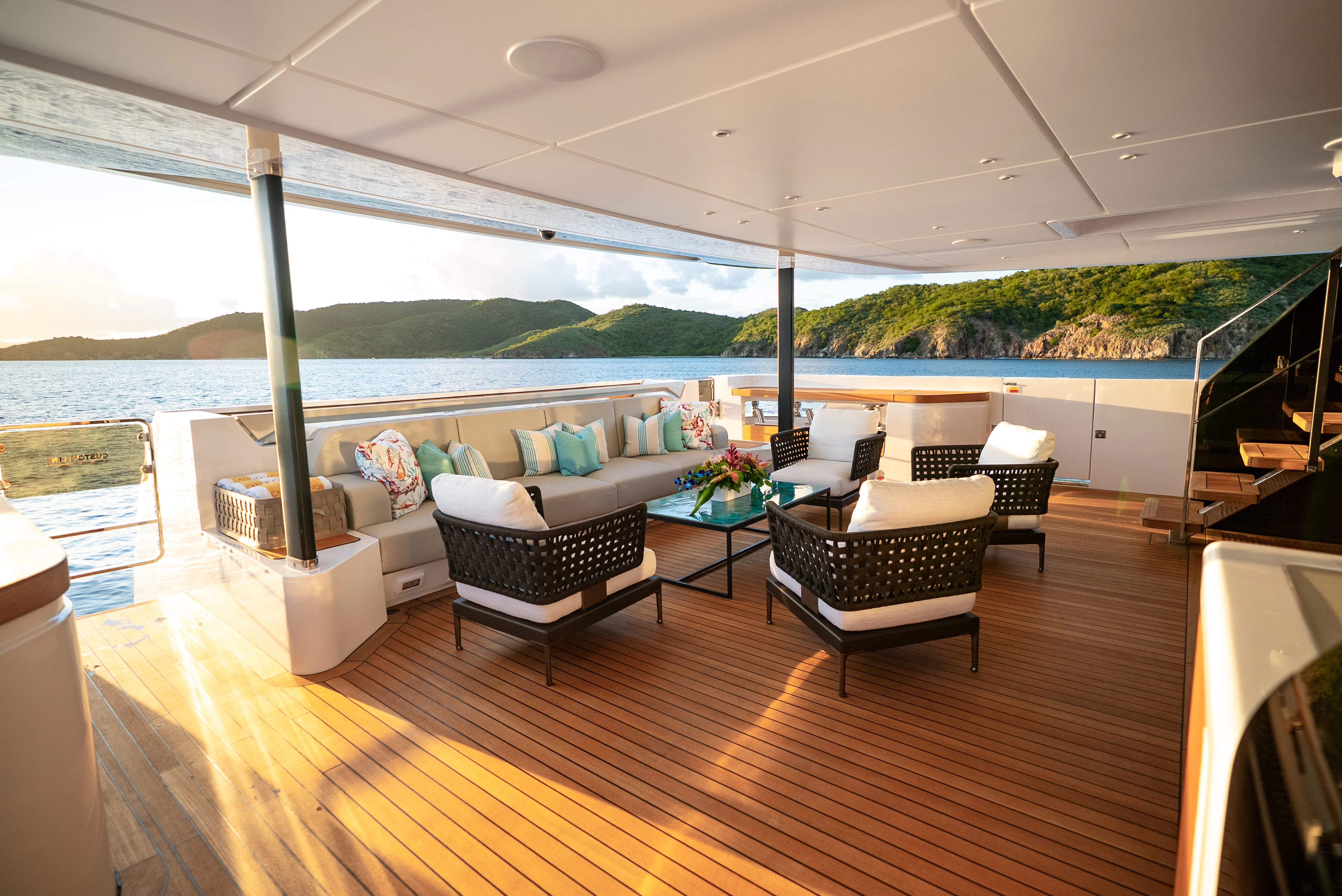 a living room with a large deck aboard CANOE CANOE Yacht for Charter