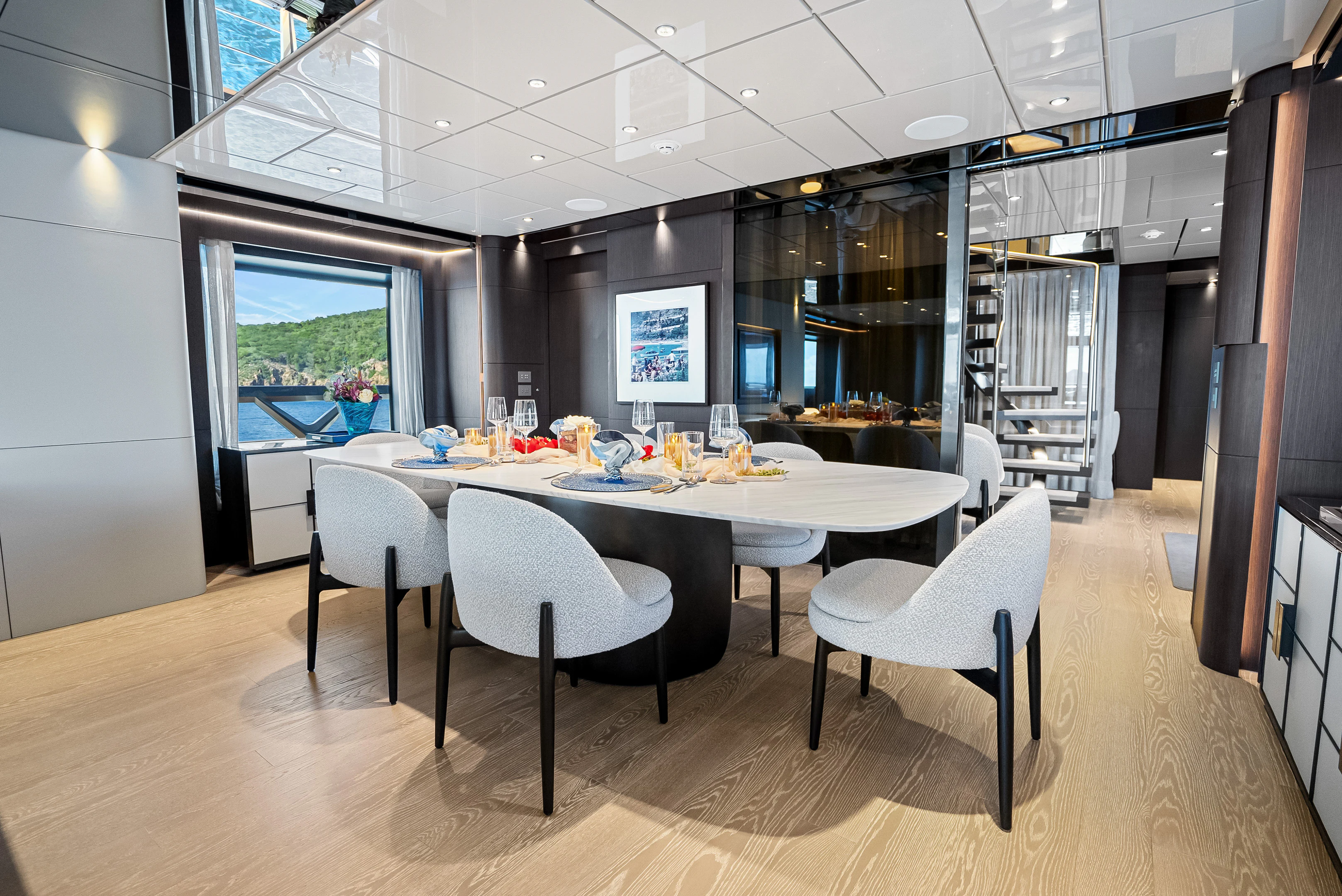 a large room with a table and chairs aboard CANOE CANOE Yacht for Charter