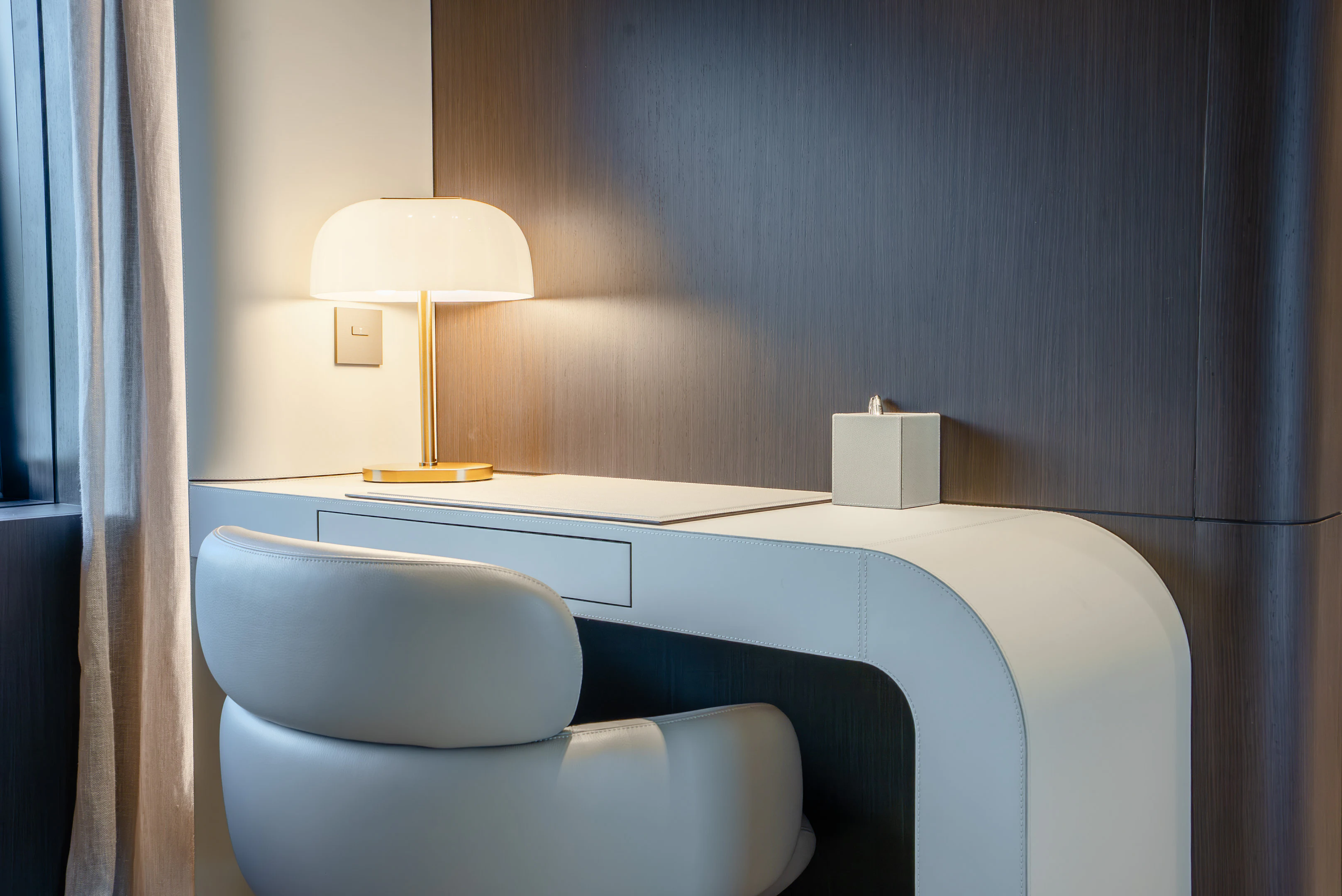 a room with a desk and a lamp aboard CANOE CANOE Yacht for Charter