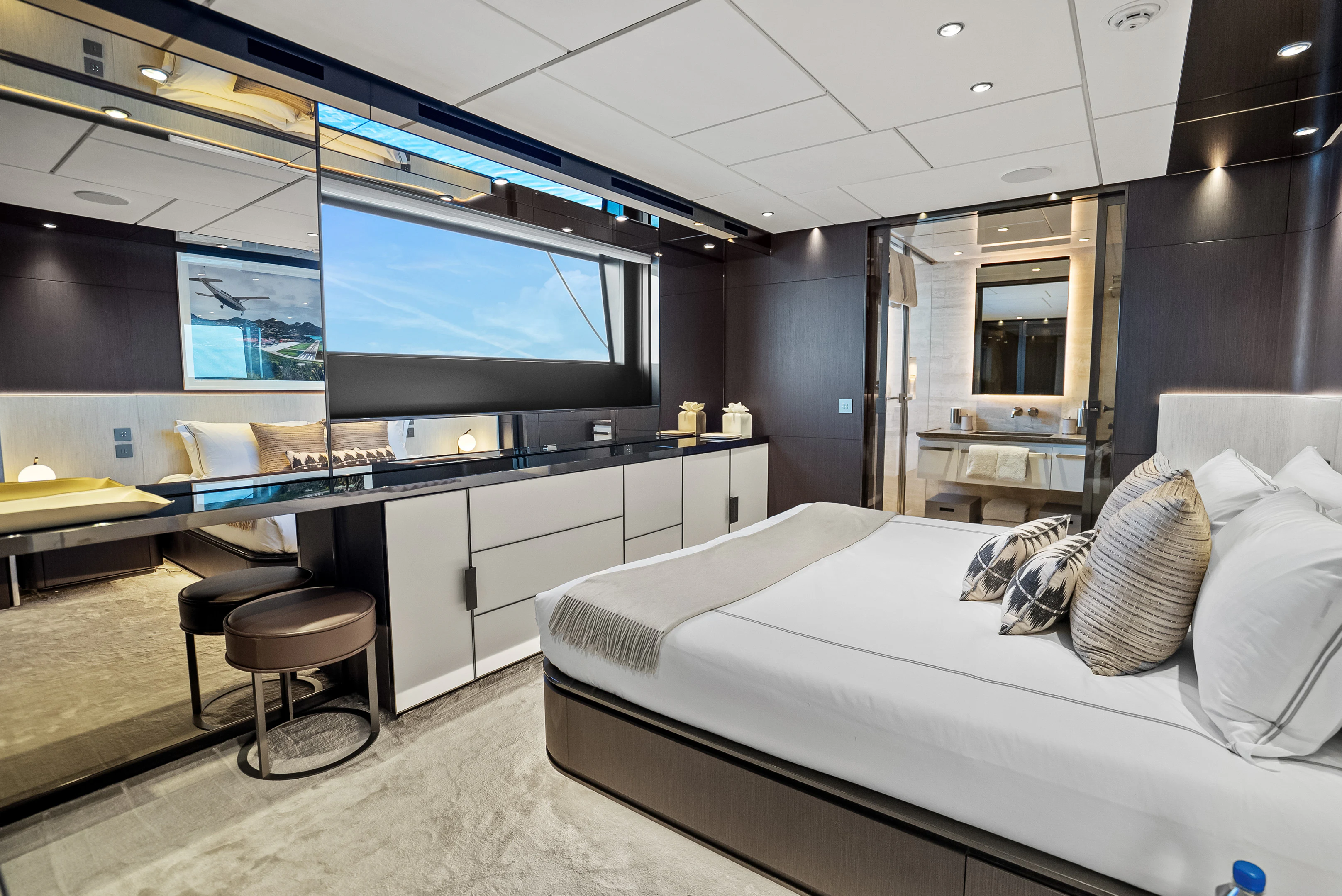 a room with a bed and a tv aboard CANOE CANOE Yacht for Charter