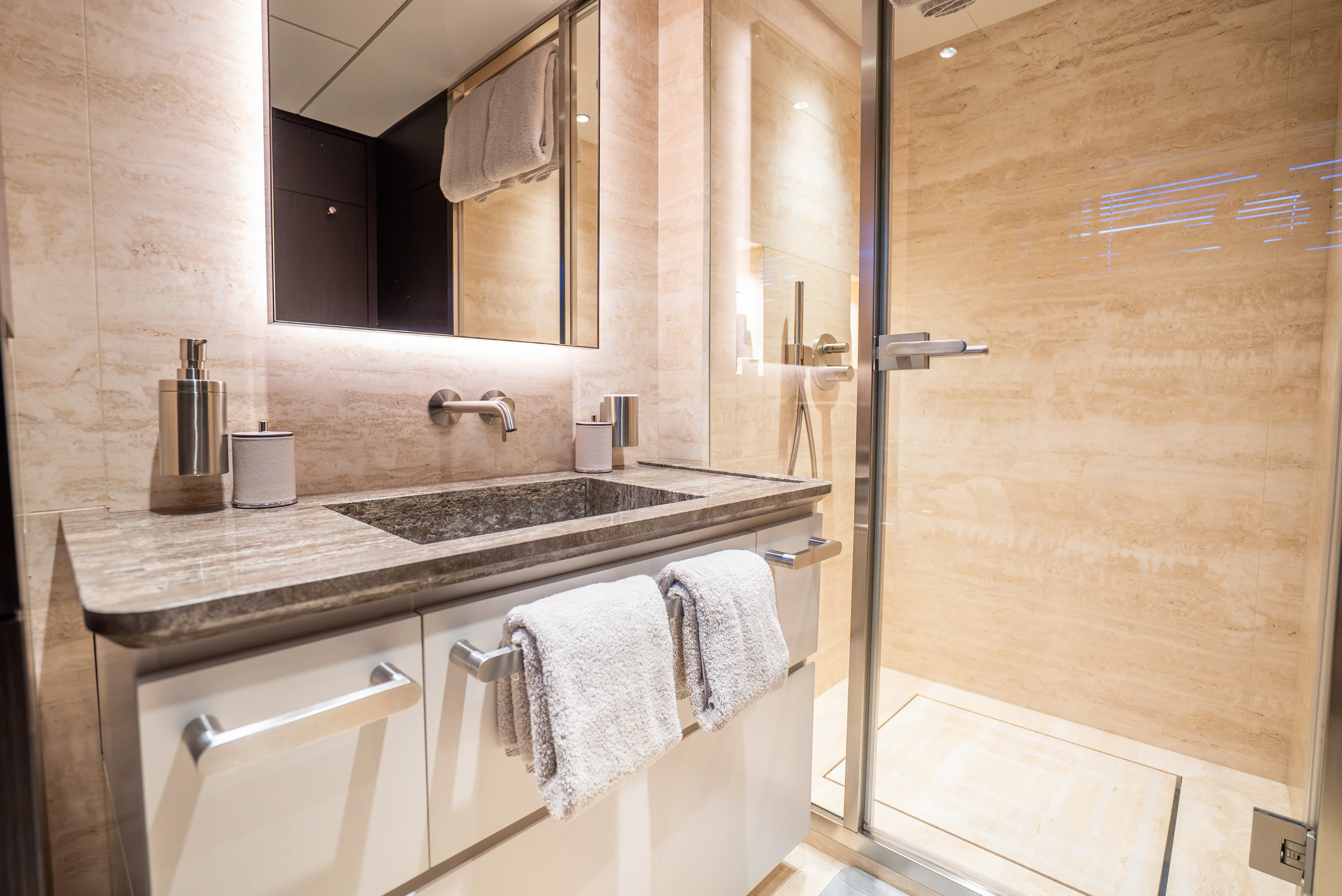 a bathroom with a sink and a mirror aboard CANOE CANOE Yacht for Charter