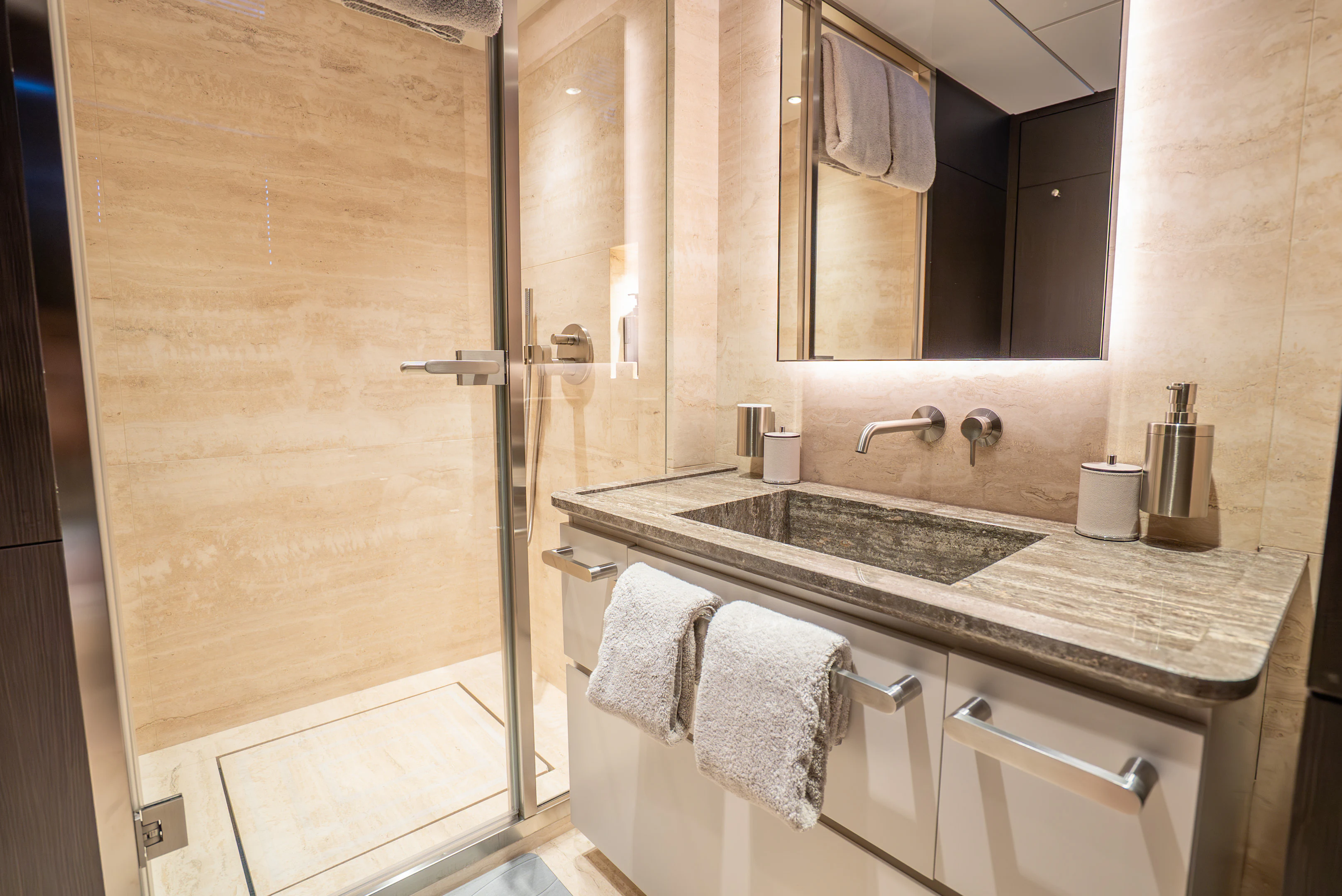 a bathroom with a sink and a mirror aboard CANOE CANOE Yacht for Charter