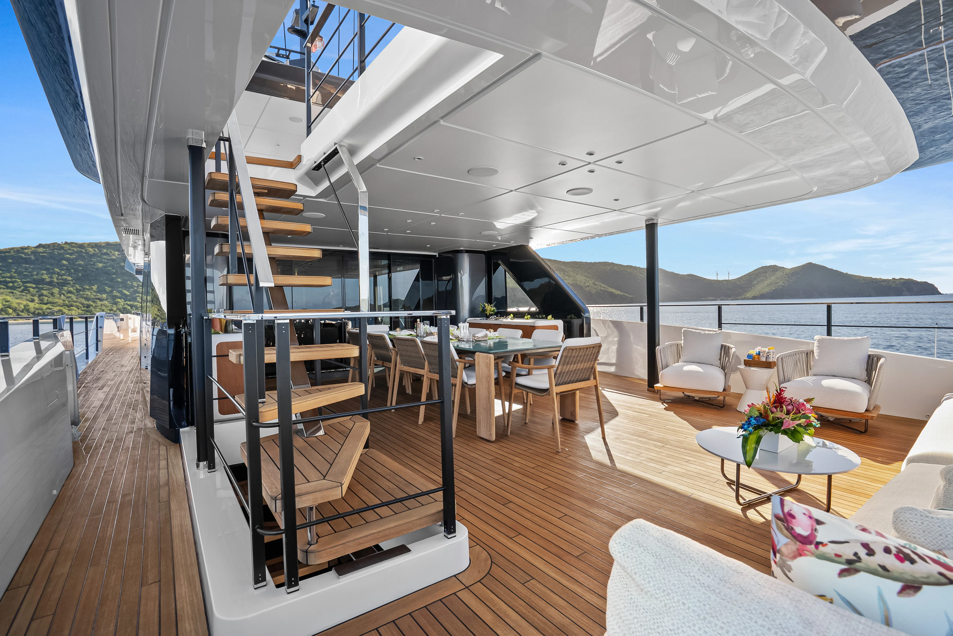 a living room with a large deck aboard CANOE CANOE Yacht for Charter