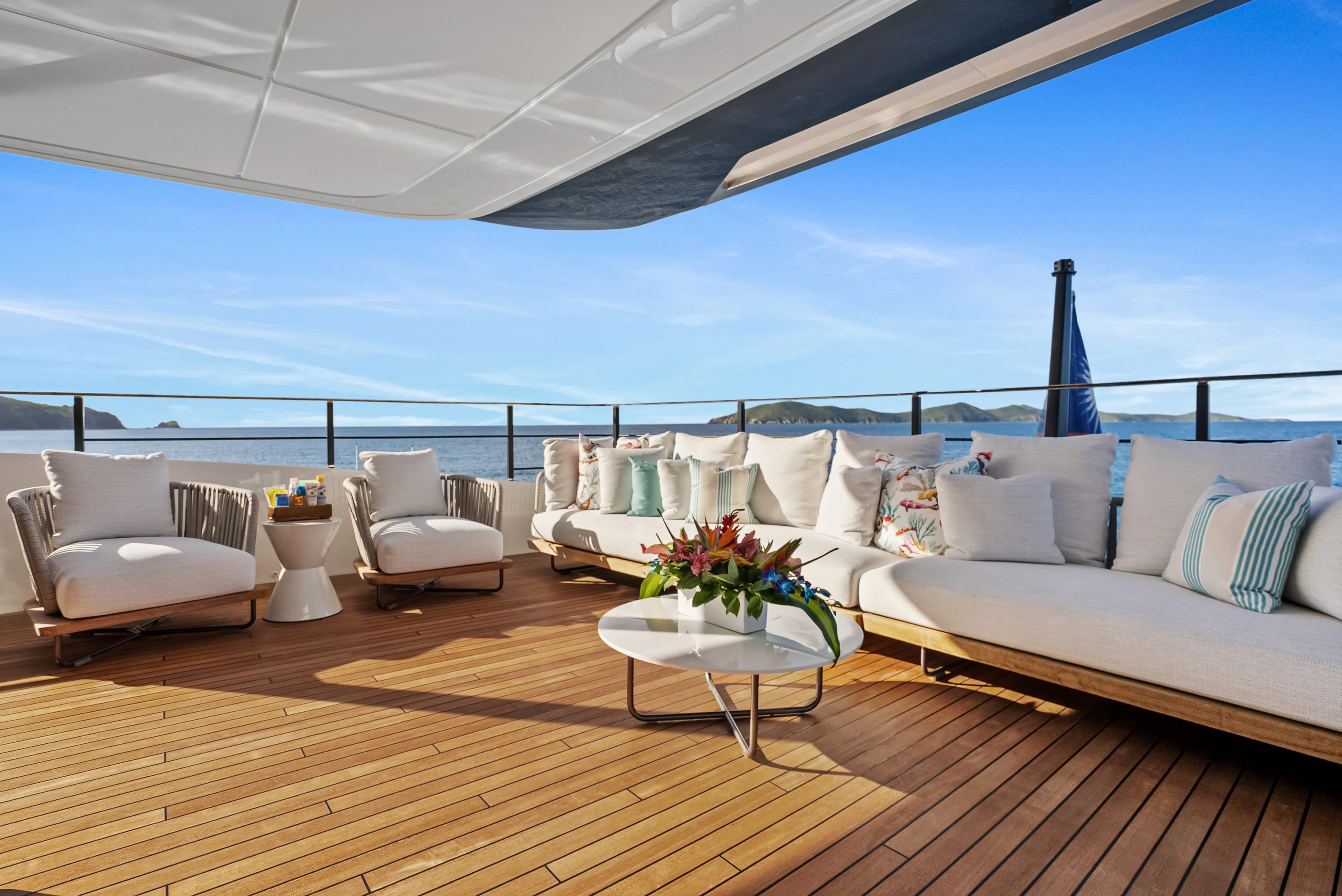 a large living room with a large blue ocean aboard CANOE CANOE Yacht for Charter