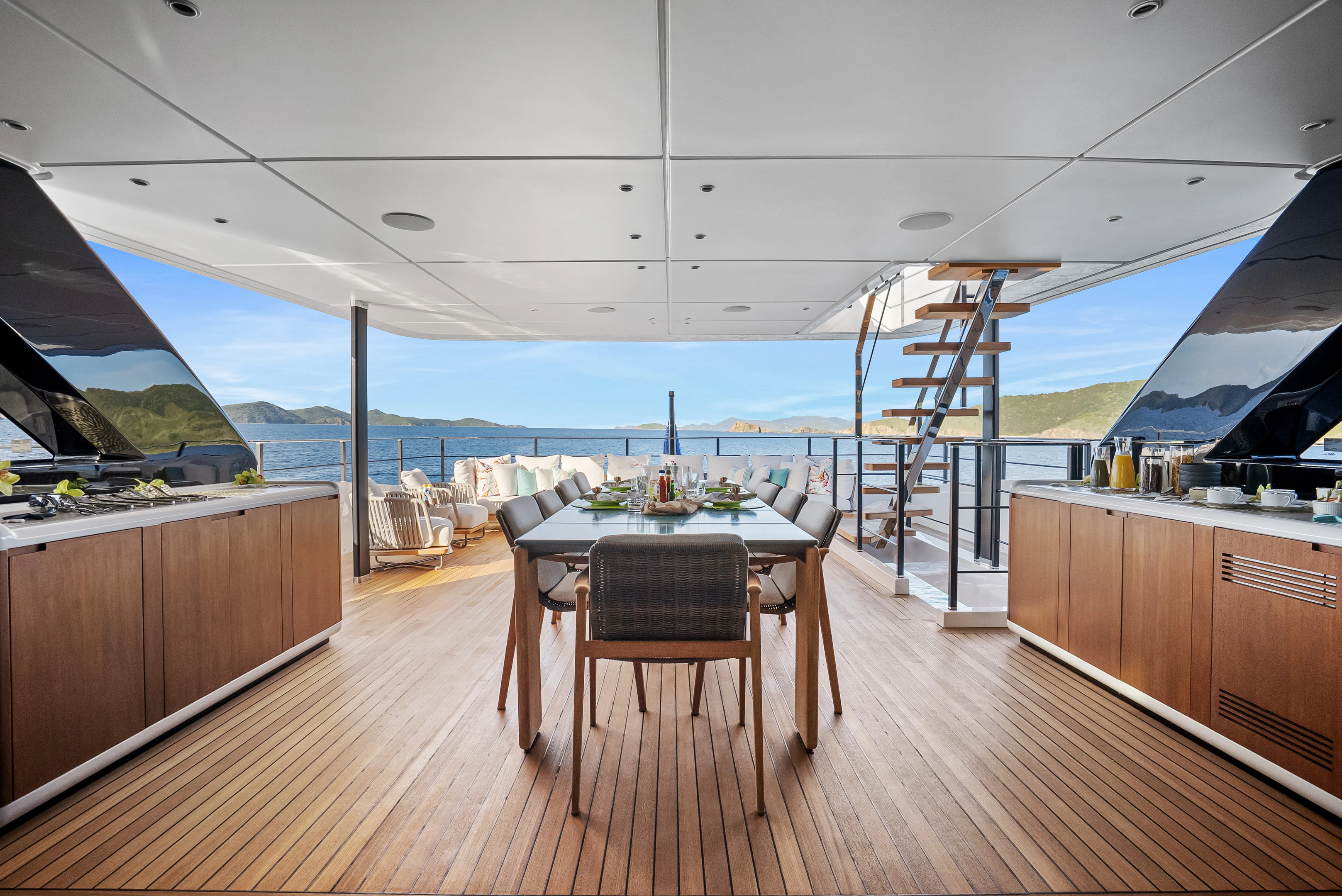 a large kitchen with a large deck overlooking the ocean aboard CANOE CANOE Yacht for Charter
