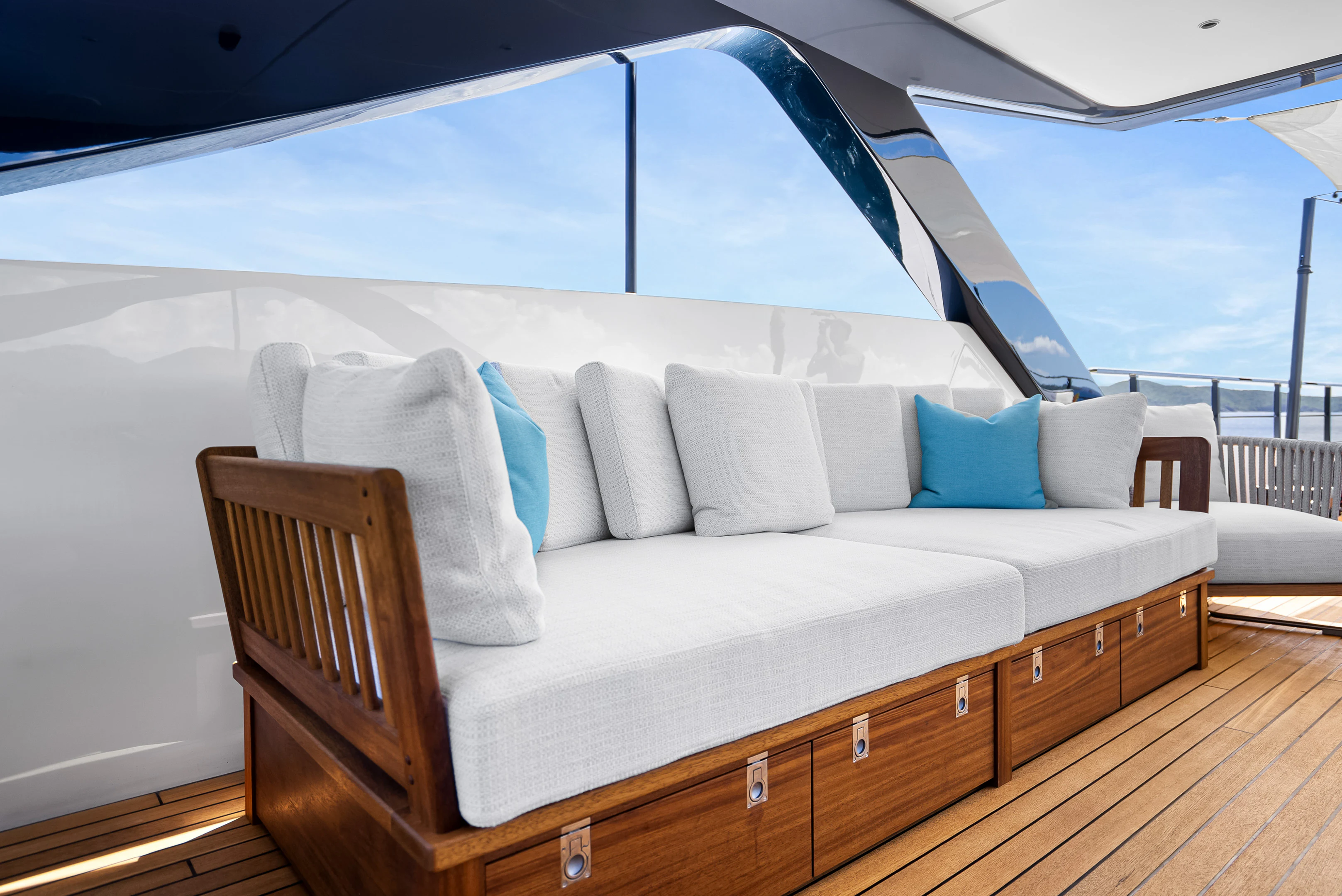 a couch with pillows on it aboard CANOE CANOE Yacht for Charter