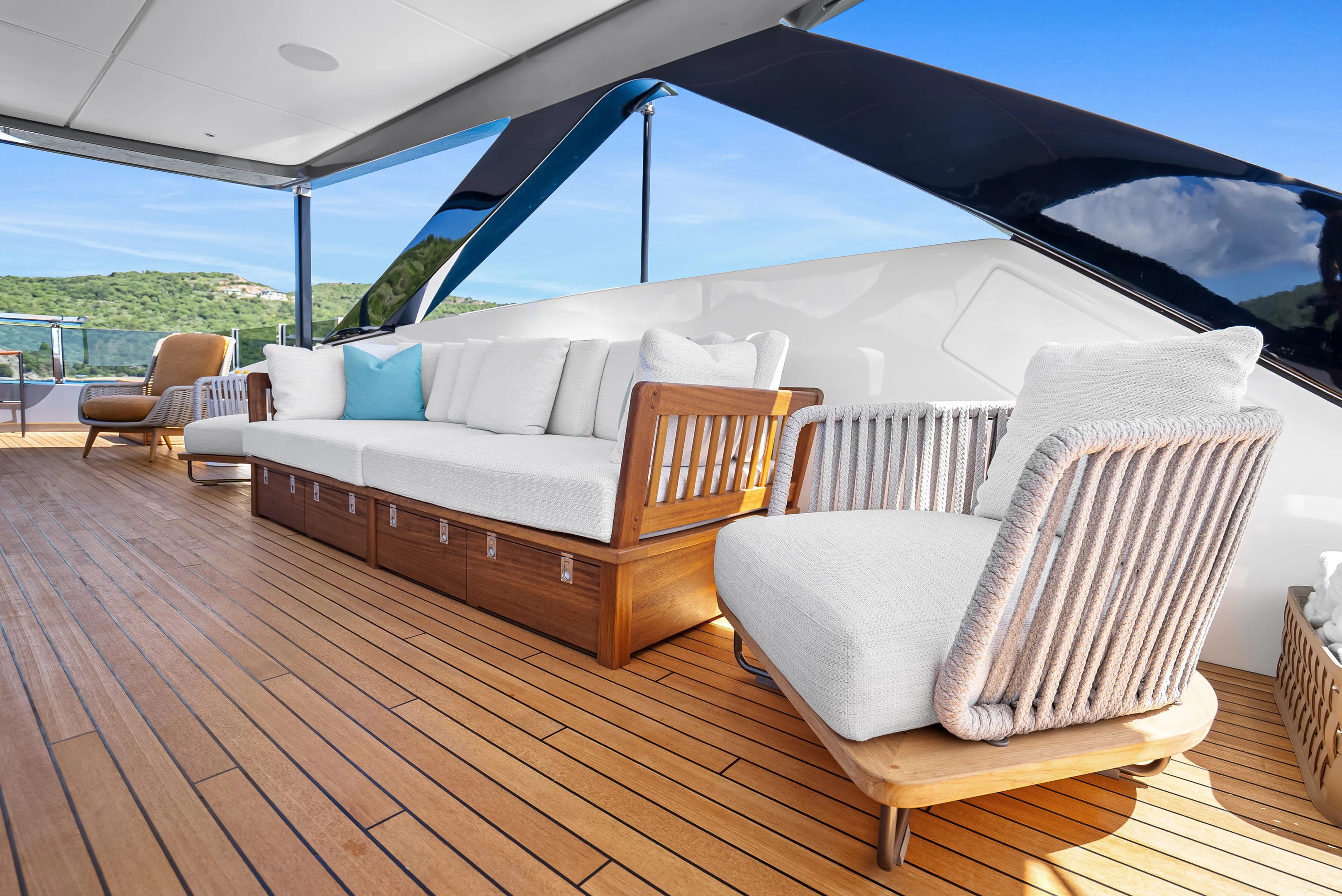 a large white tent with a couch and chairs aboard CANOE CANOE Yacht for Charter