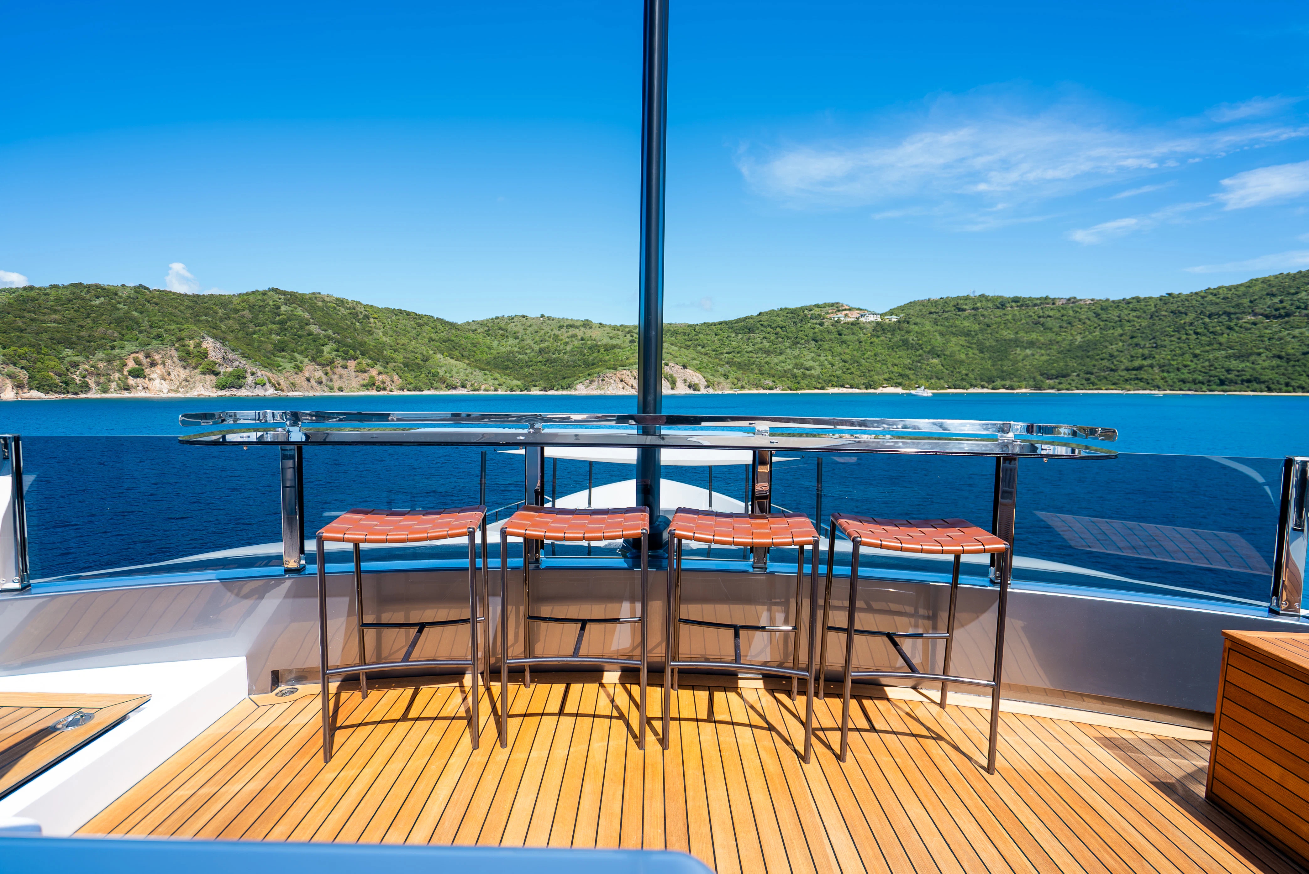 a deck with chairs and a table on it aboard CANOE CANOE Yacht for Charter