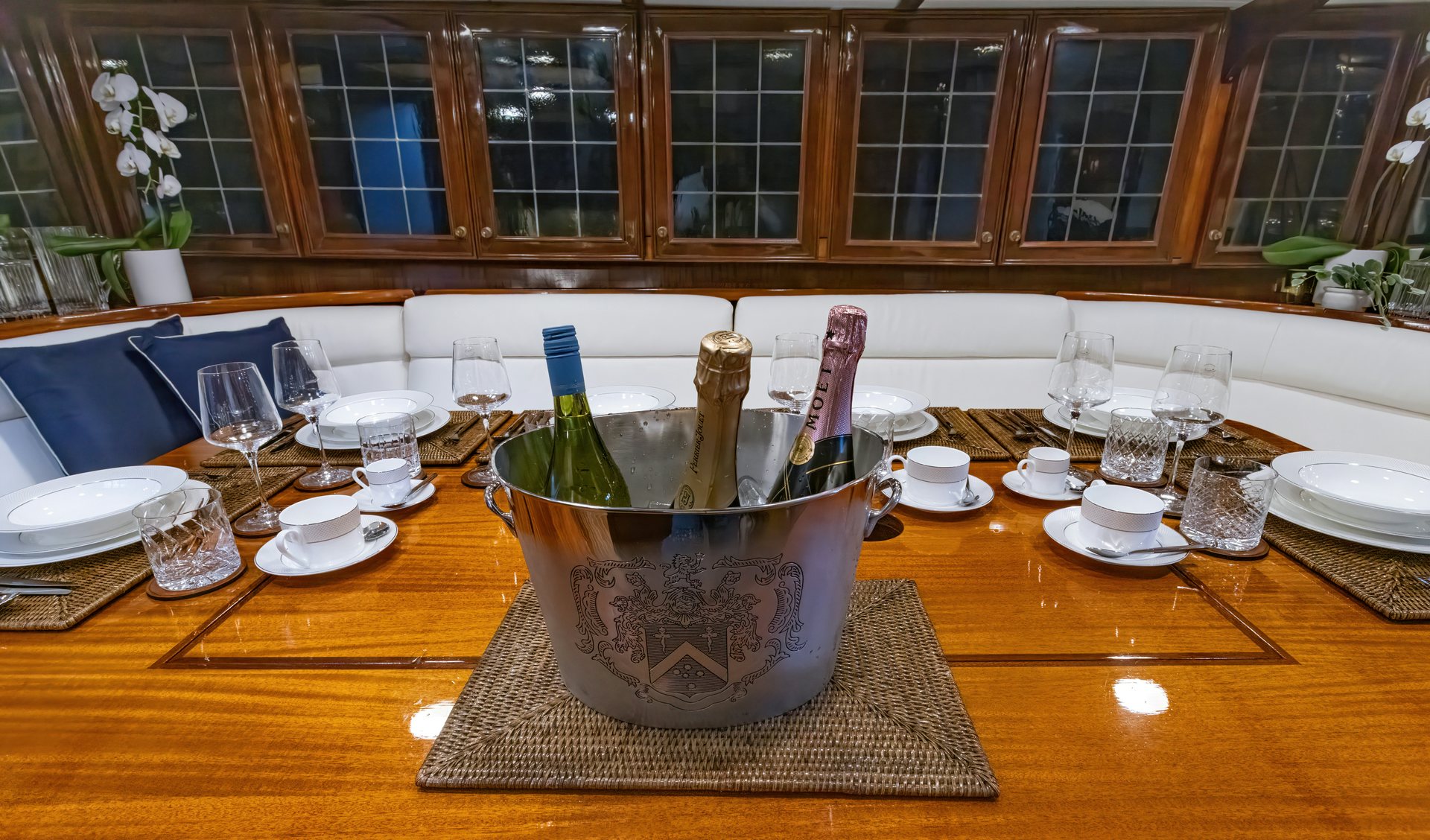 a table with plates and glasses aboard HERMITAGE Yacht for Sale