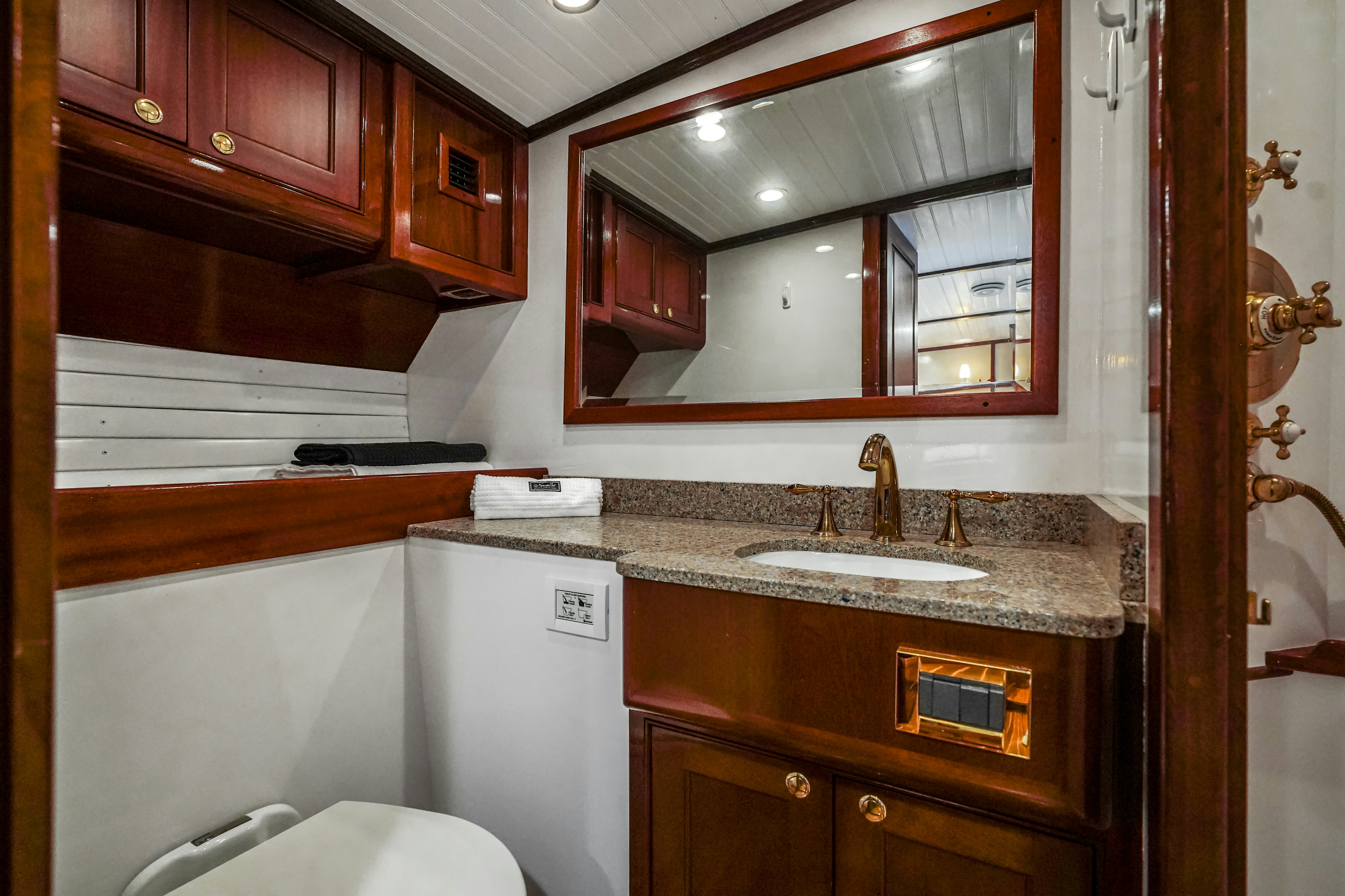 a bathroom with a large mirror aboard HERMITAGE Yacht for Sale