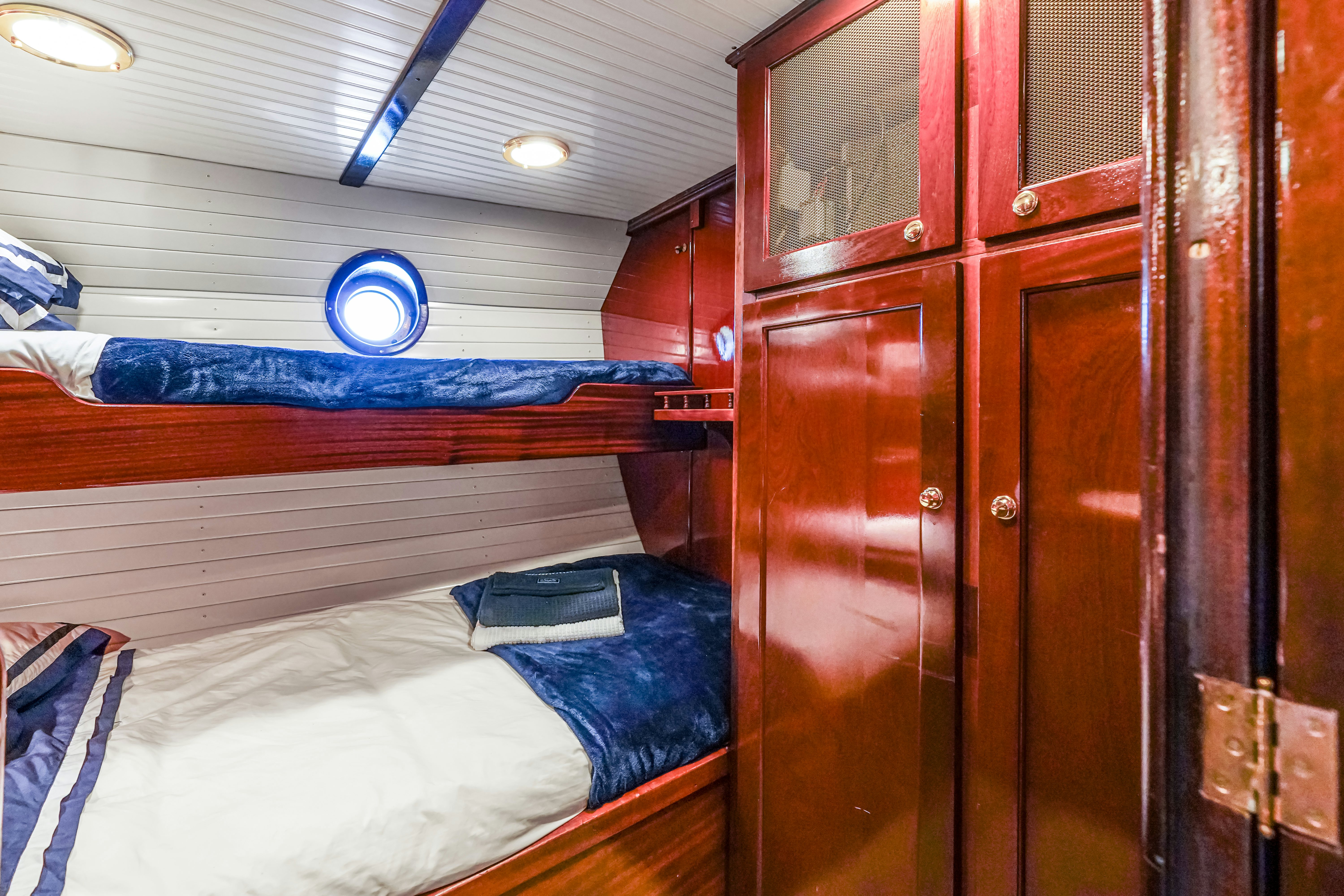 a room with bunk beds aboard HERMITAGE Yacht for Sale