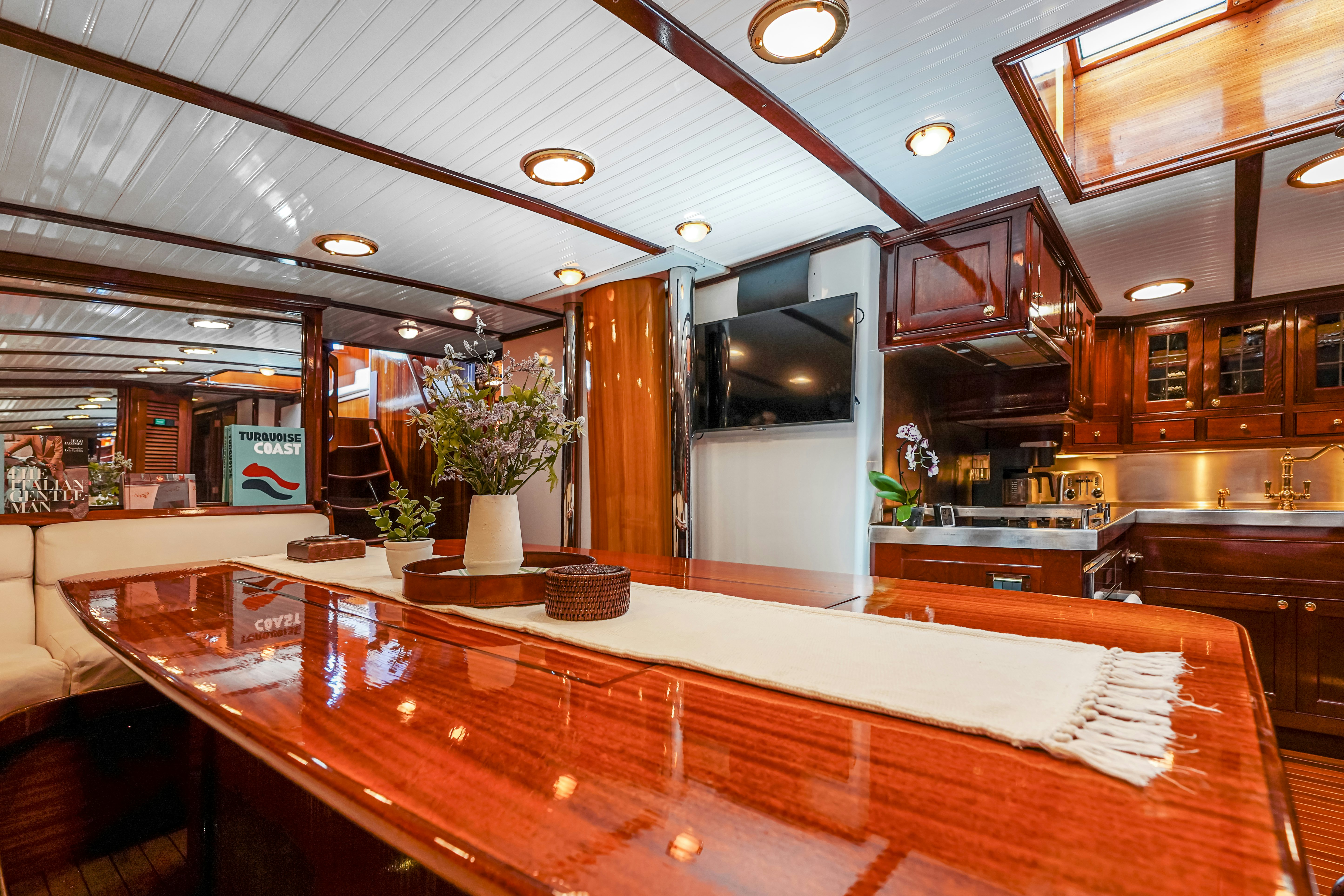 a large room with a large wood table and a large window aboard HERMITAGE Yacht for Sale