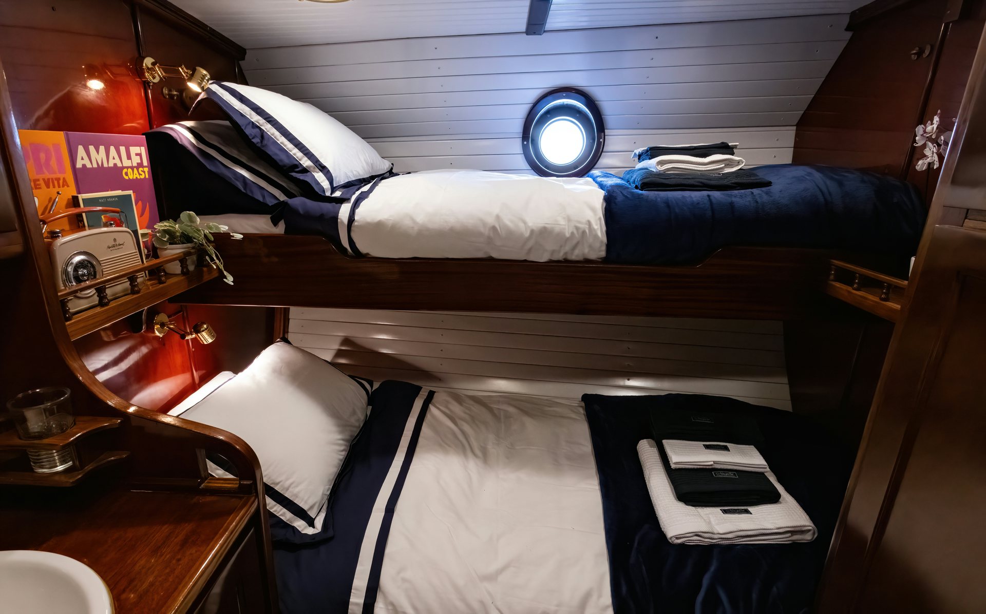 a person lying on a bed aboard HERMITAGE Yacht for Sale