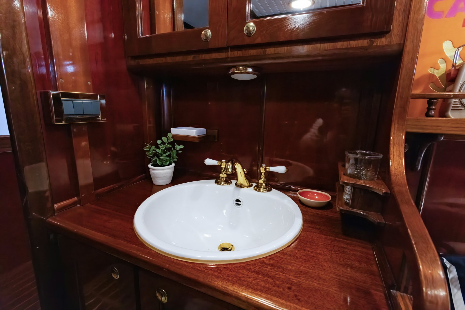a bathroom sink with a mirror above it aboard HERMITAGE Yacht for Sale