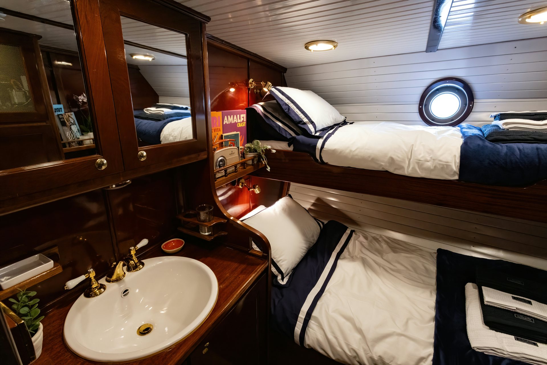 a bathroom with a sink and a mirror aboard HERMITAGE Yacht for Sale