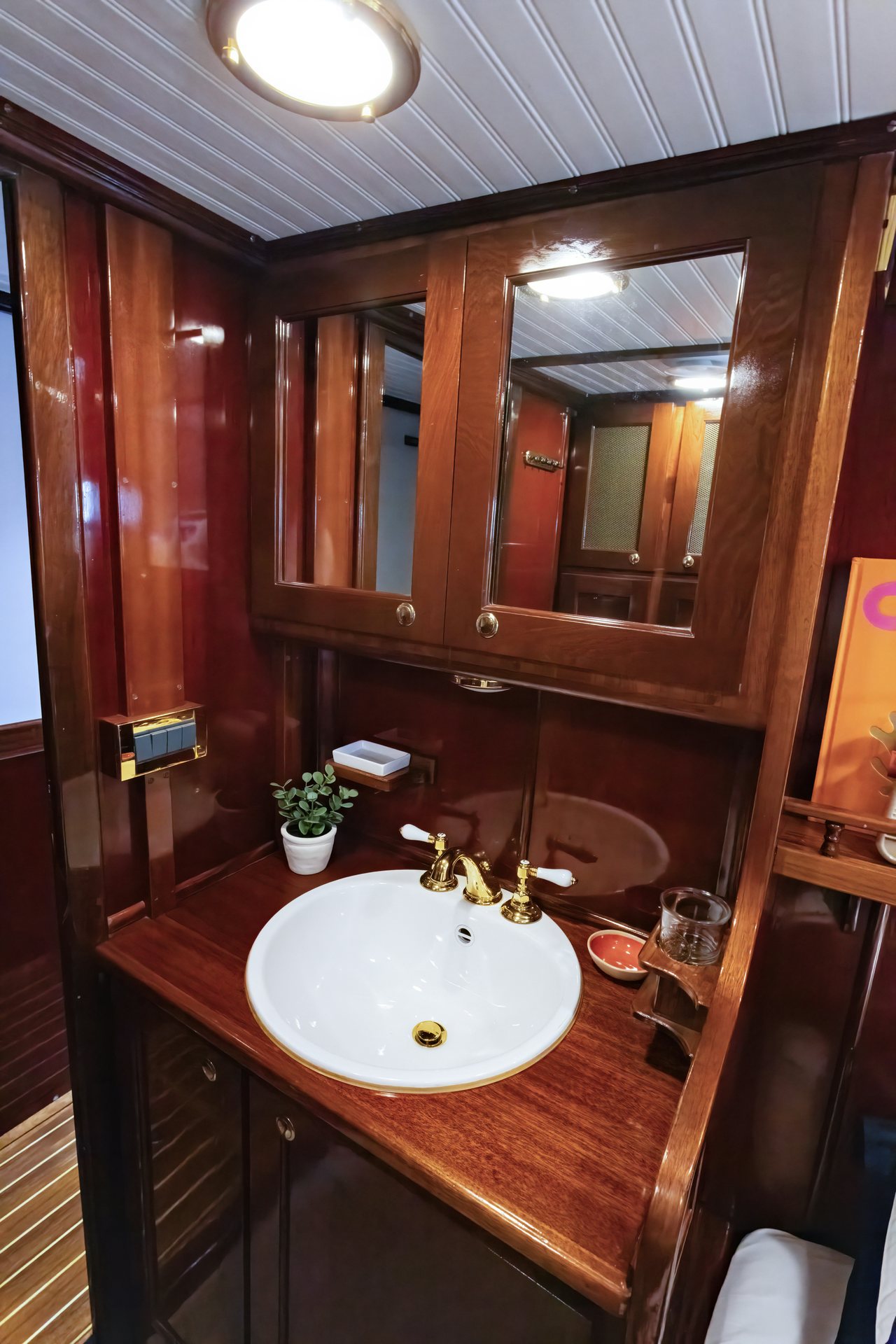 a bathroom with a sink and a mirror aboard HERMITAGE Yacht for Sale