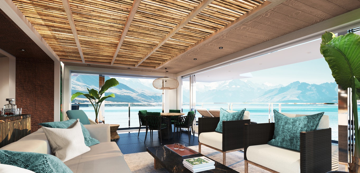 a room with a couch and a table and chairs aboard KING BENJI Yacht for Sale