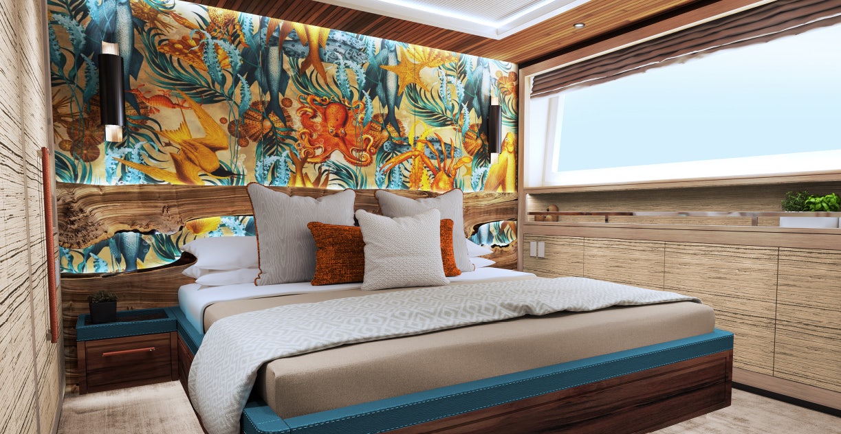 a bed with a painting on the wall aboard KING BENJI Yacht for Sale