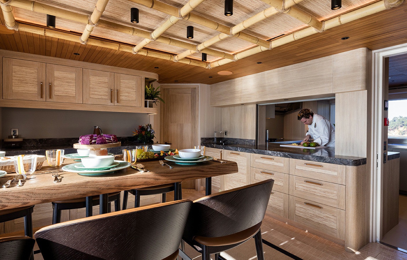 a person in a kitchen aboard KING BENJI Yacht for Sale