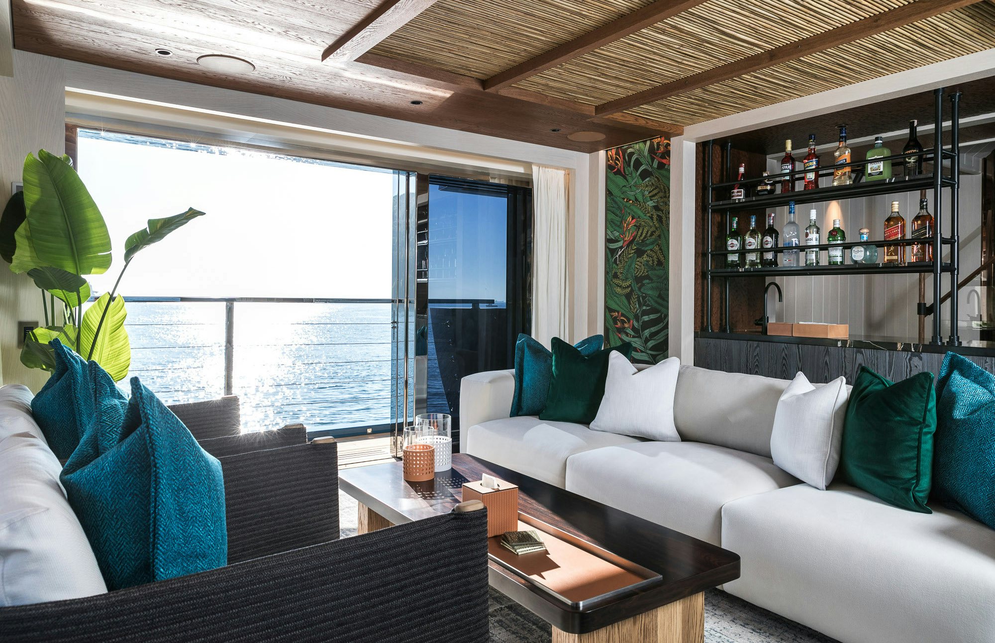 a living room with a couch and a coffee table aboard KING BENJI Yacht for Sale