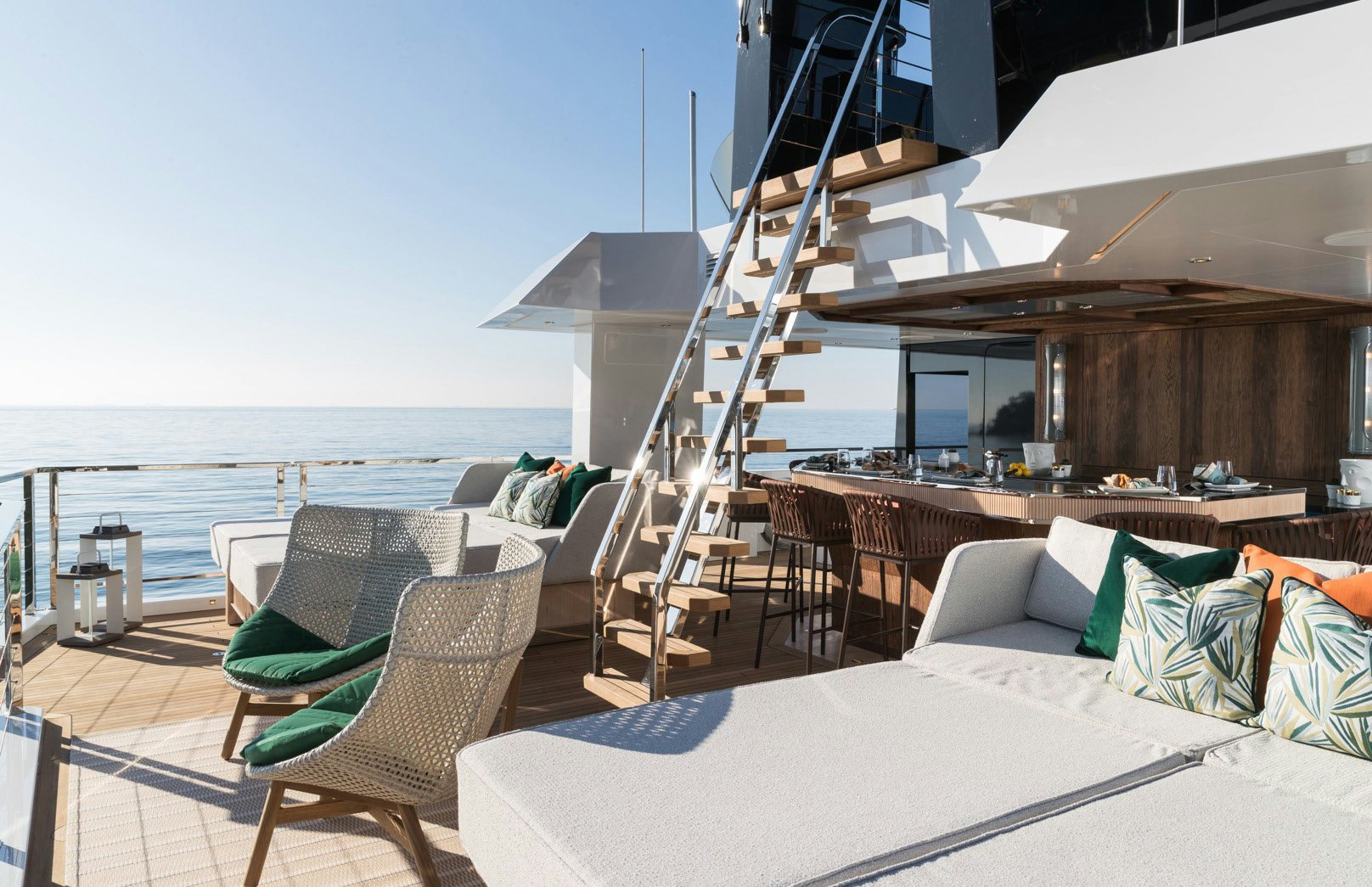 a room with a bed and a table and chairs aboard KING BENJI Yacht for Sale