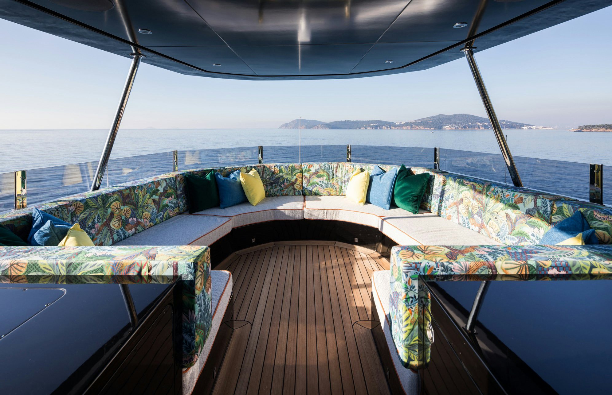 a room with a view of the ocean and the mountains aboard KING BENJI Yacht for Sale