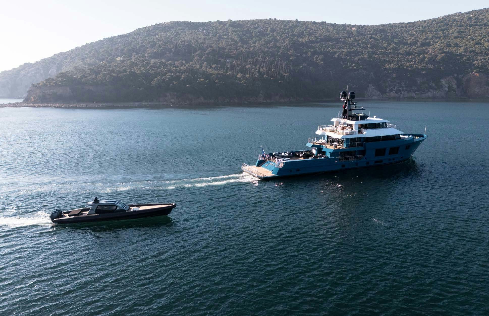 a couple of boats on the water aboard KING BENJI Yacht for Sale