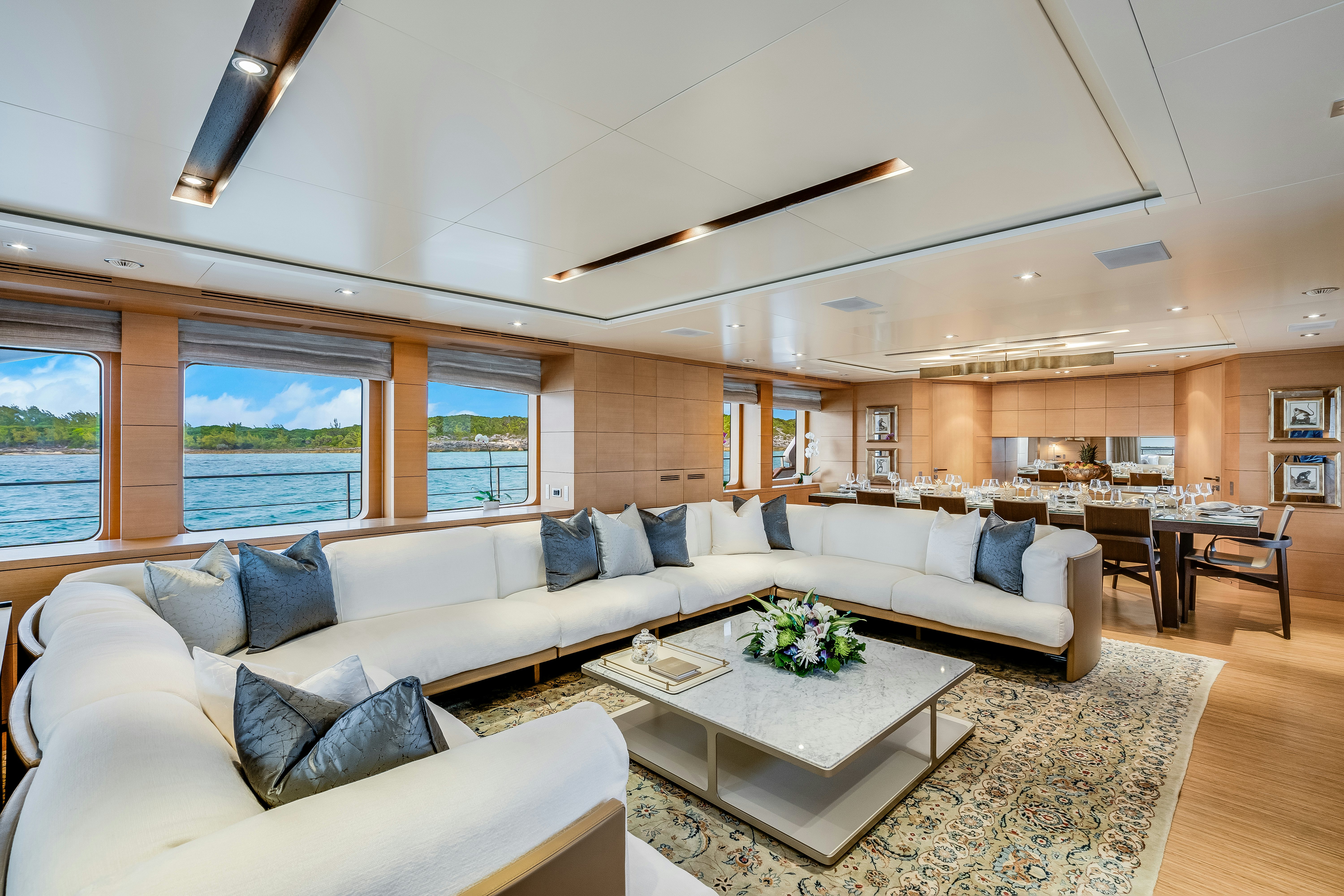 a living room with a large window aboard LADY H Yacht for Charter