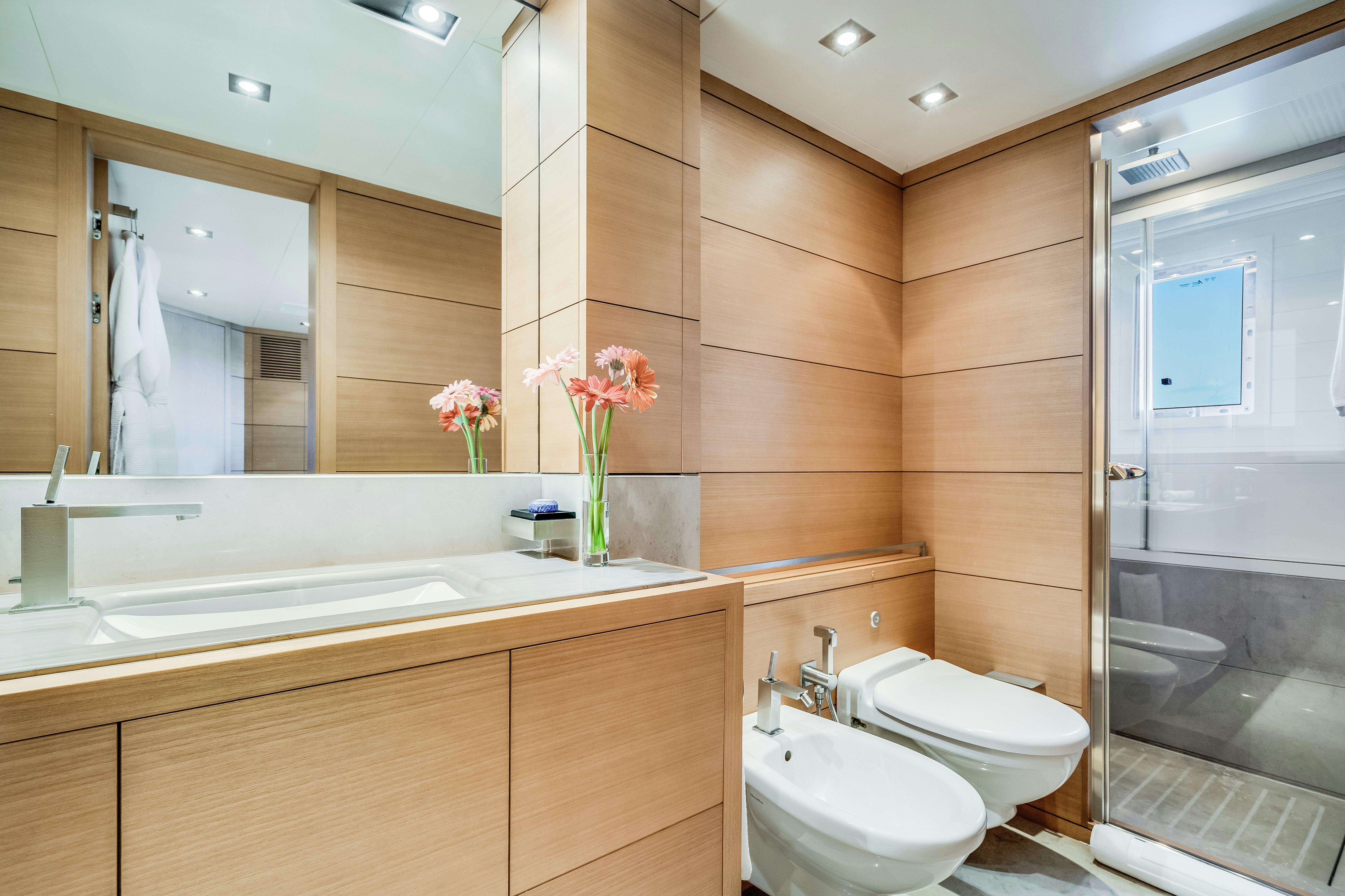 a bathroom with a large mirror aboard LADY H Yacht for Charter