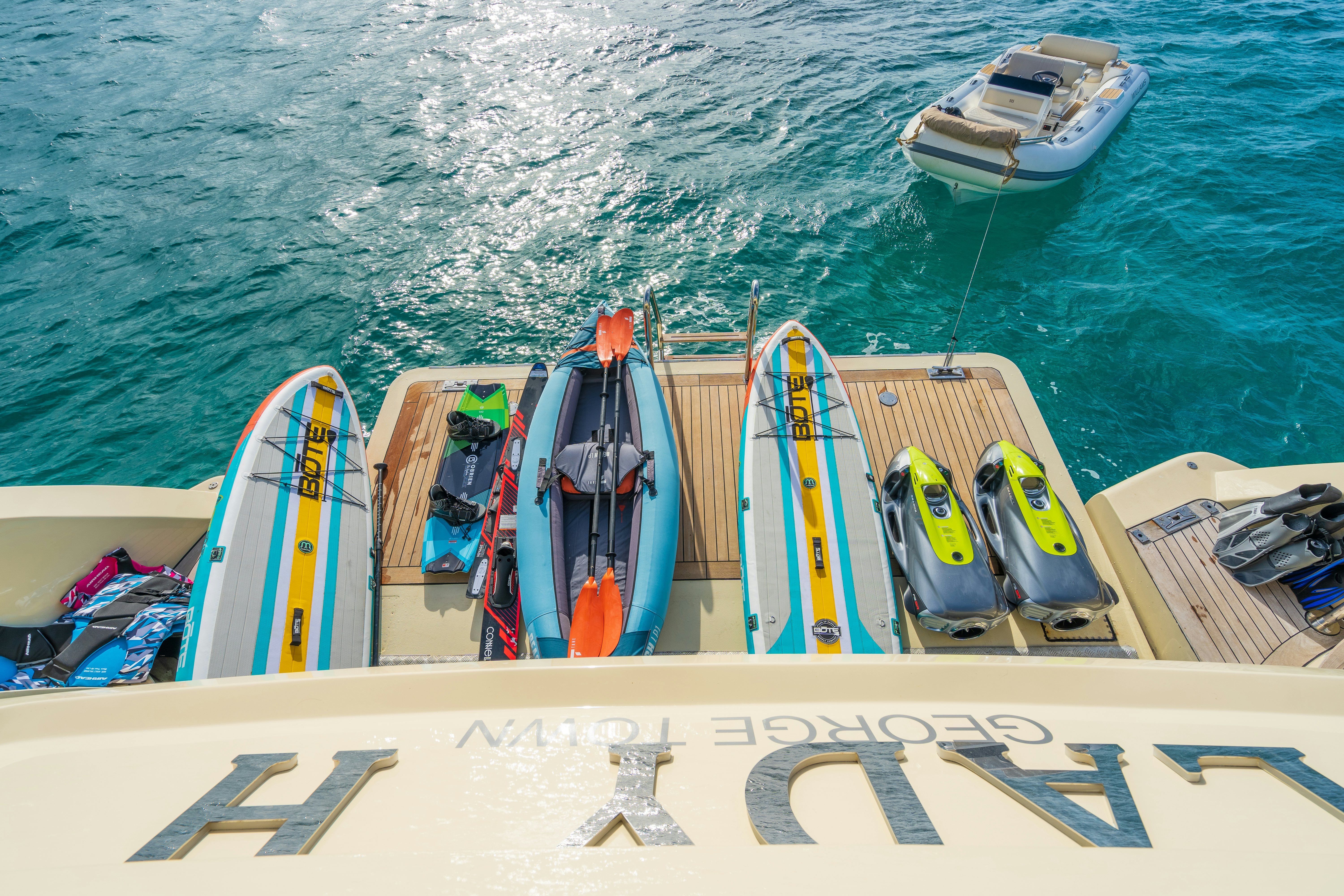 a boat with paddles on the water aboard LADY H Yacht for Charter