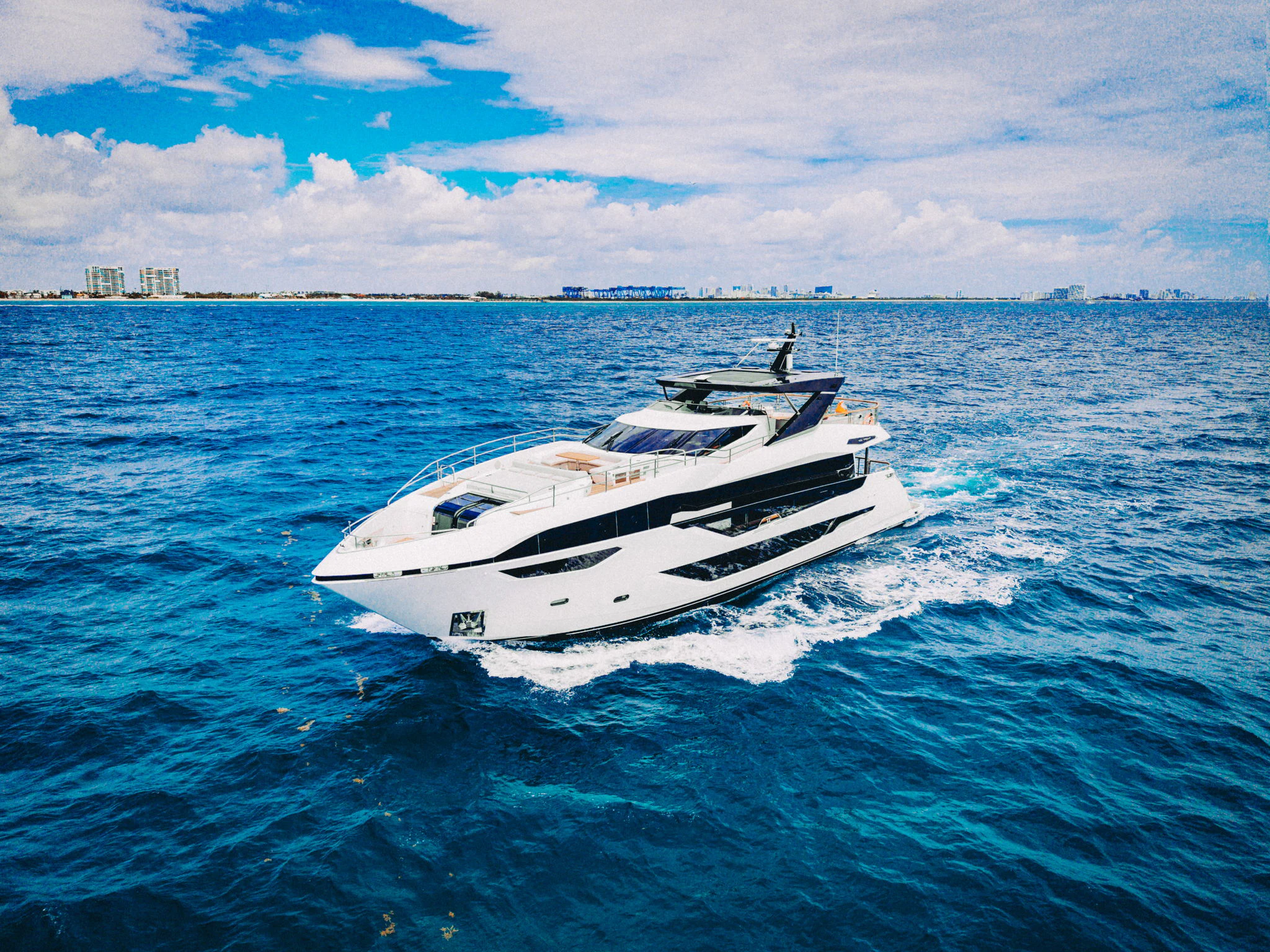 a white boat on the water aboard PURA VIDA Yacht for Sale