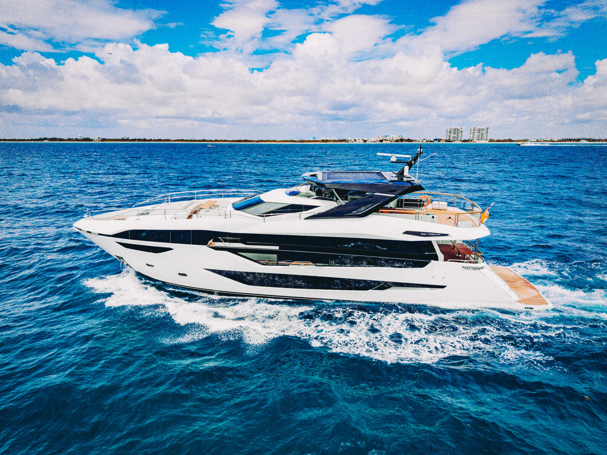 a white yacht in the water aboard PURA VIDA Yacht for Sale
