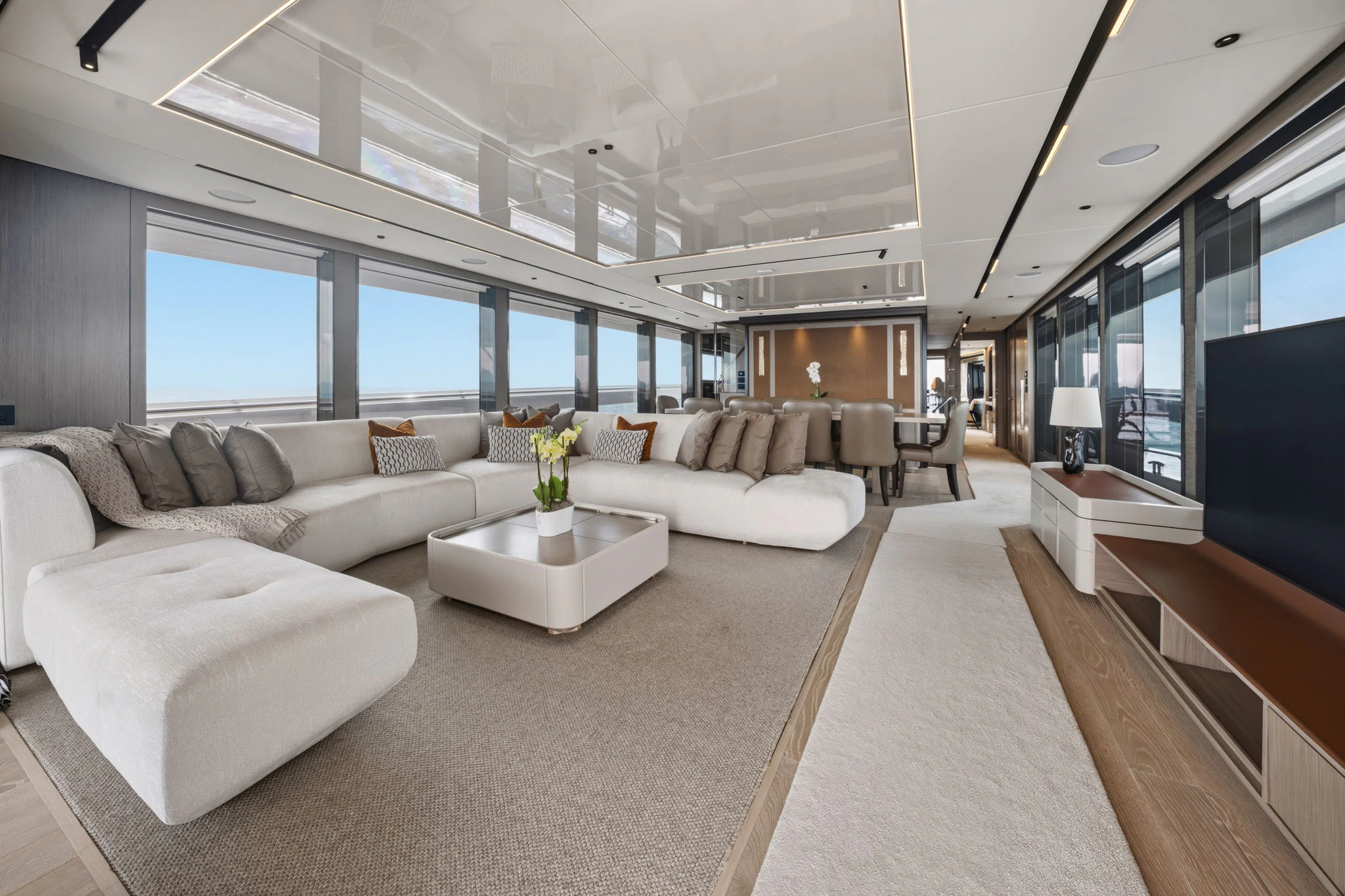 a living room with a large window aboard PURA VIDA Yacht for Sale