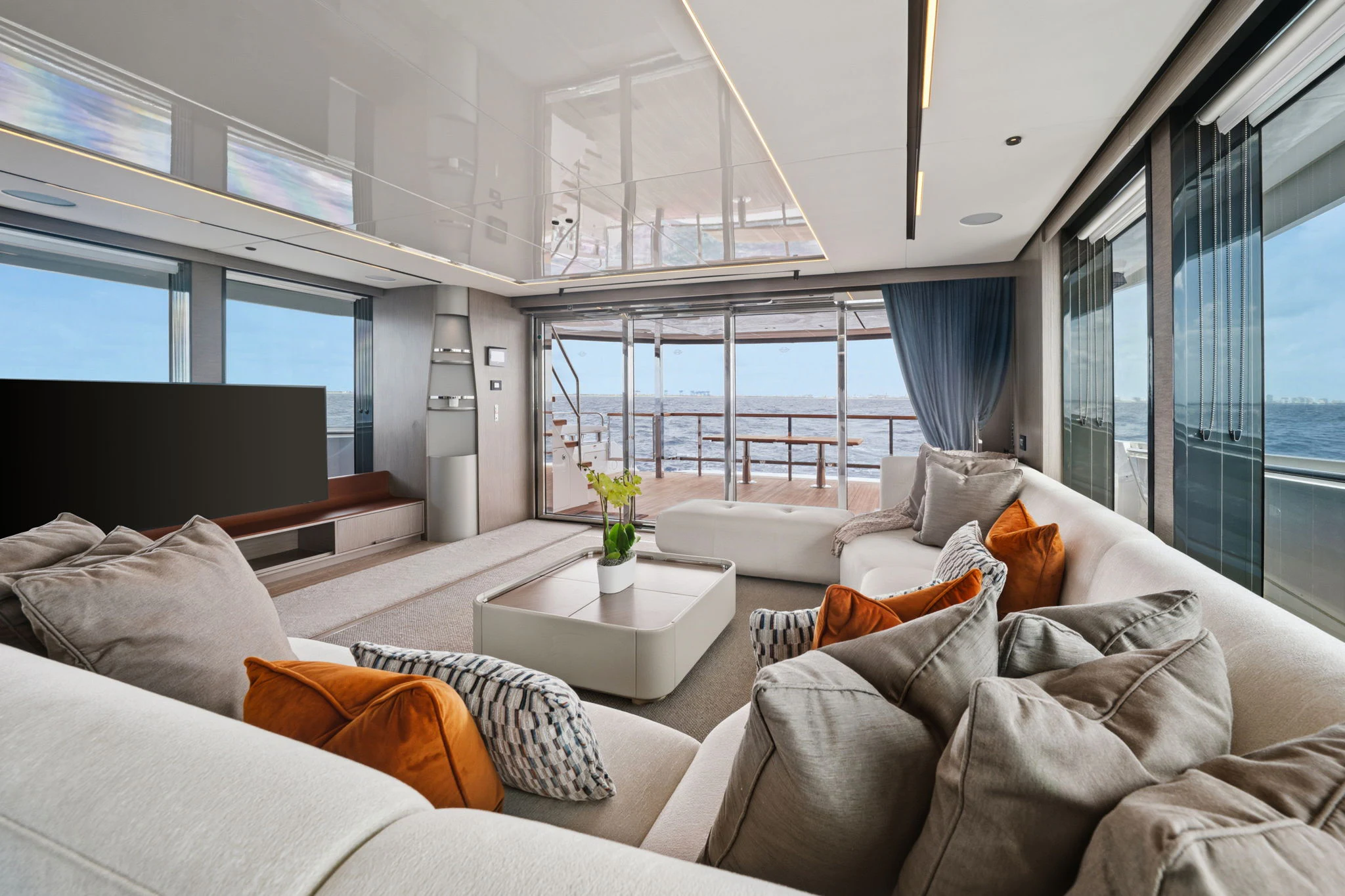 a living room with a large window aboard PURA VIDA Yacht for Sale