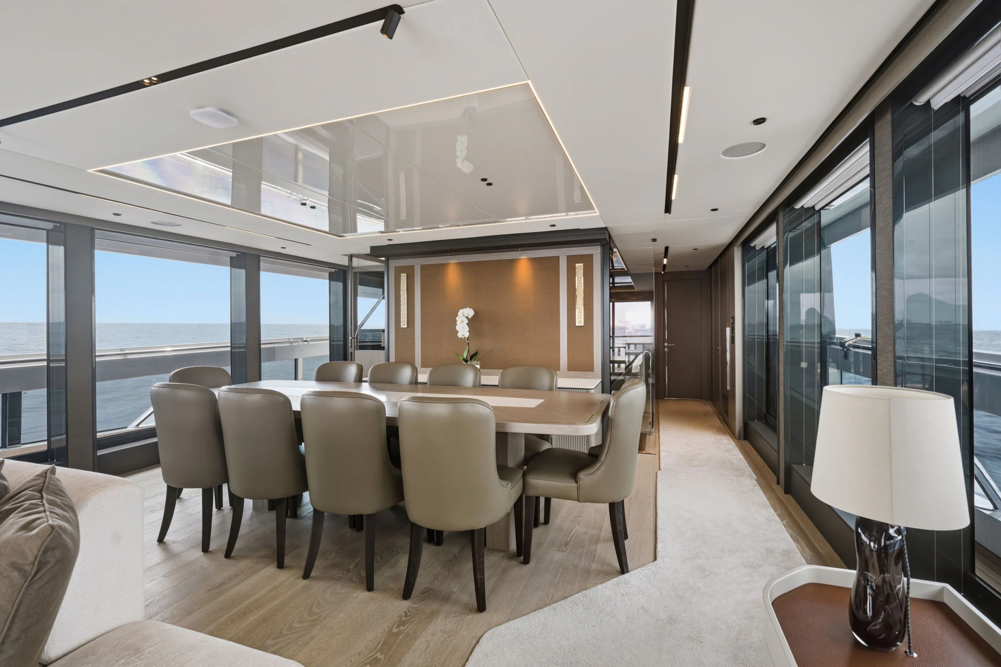 a room with a table and chairs aboard PURA VIDA Yacht for Sale