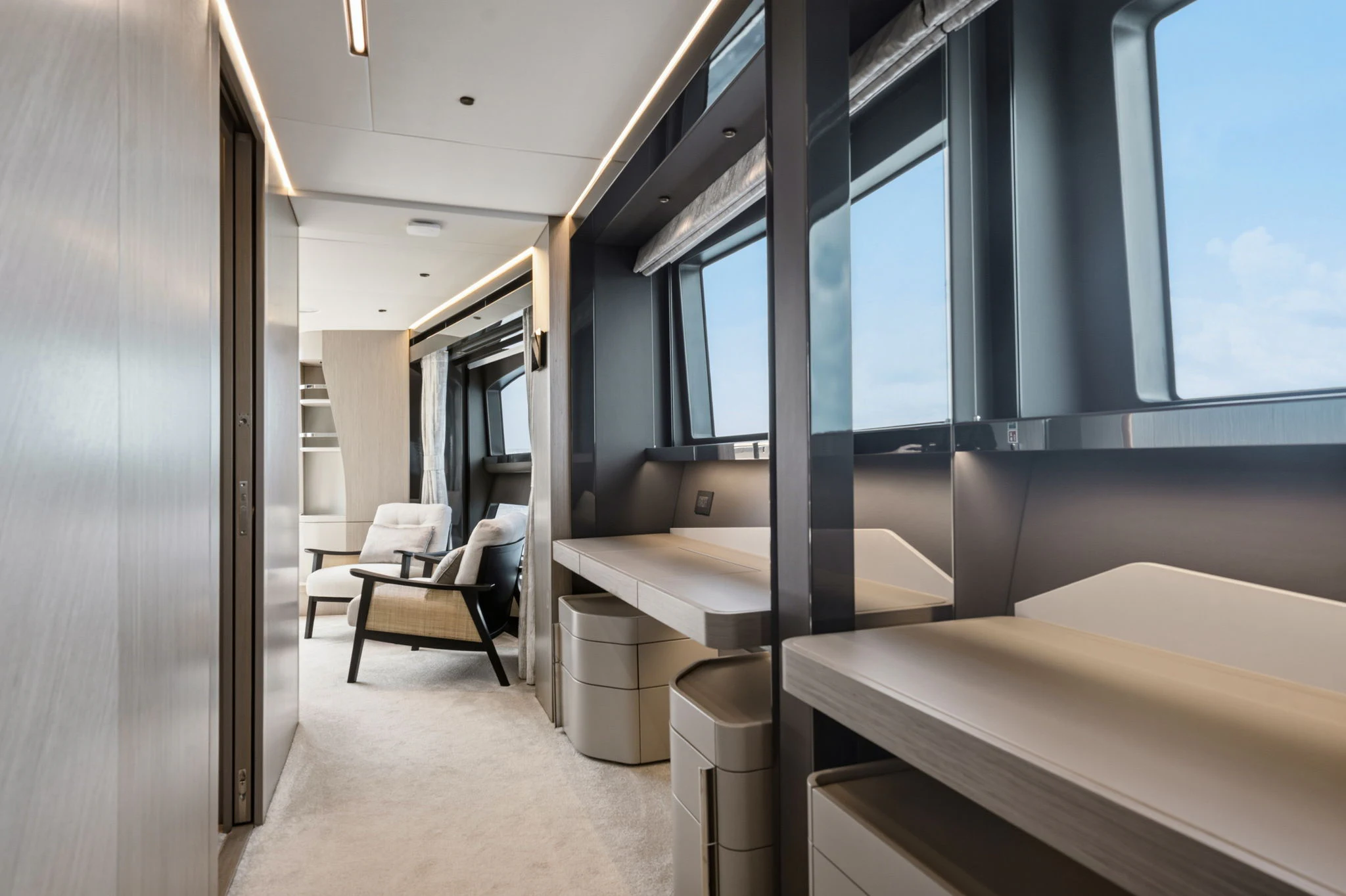 a room with a bed and a desk aboard PURA VIDA Yacht for Sale