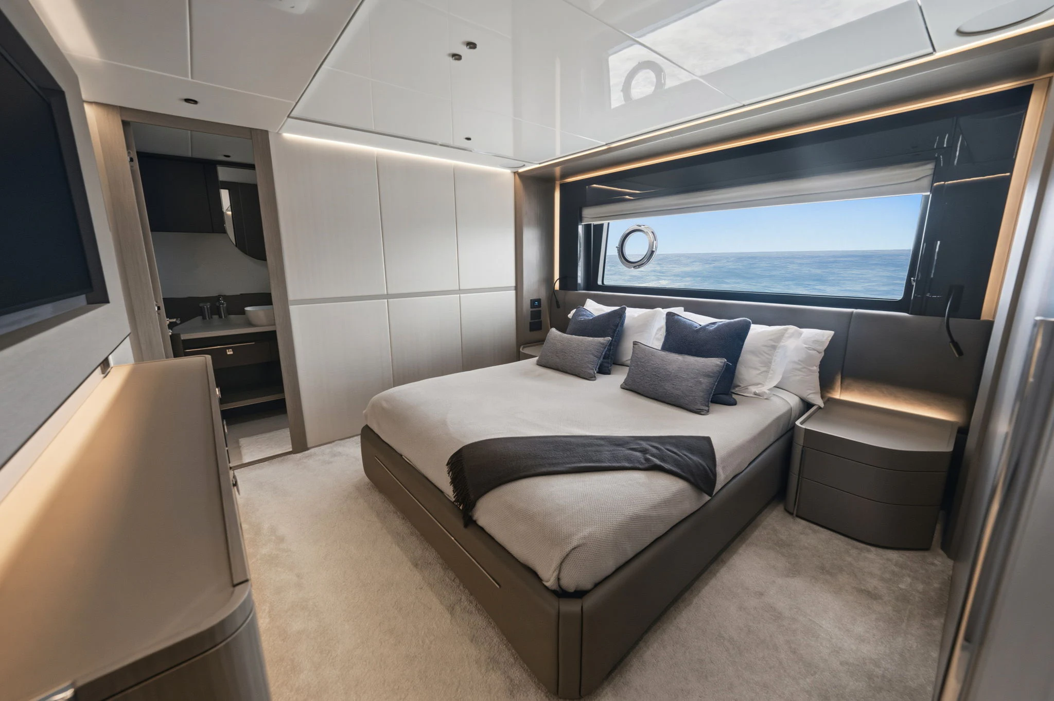 a room with a bed and a window aboard PURA VIDA Yacht for Sale