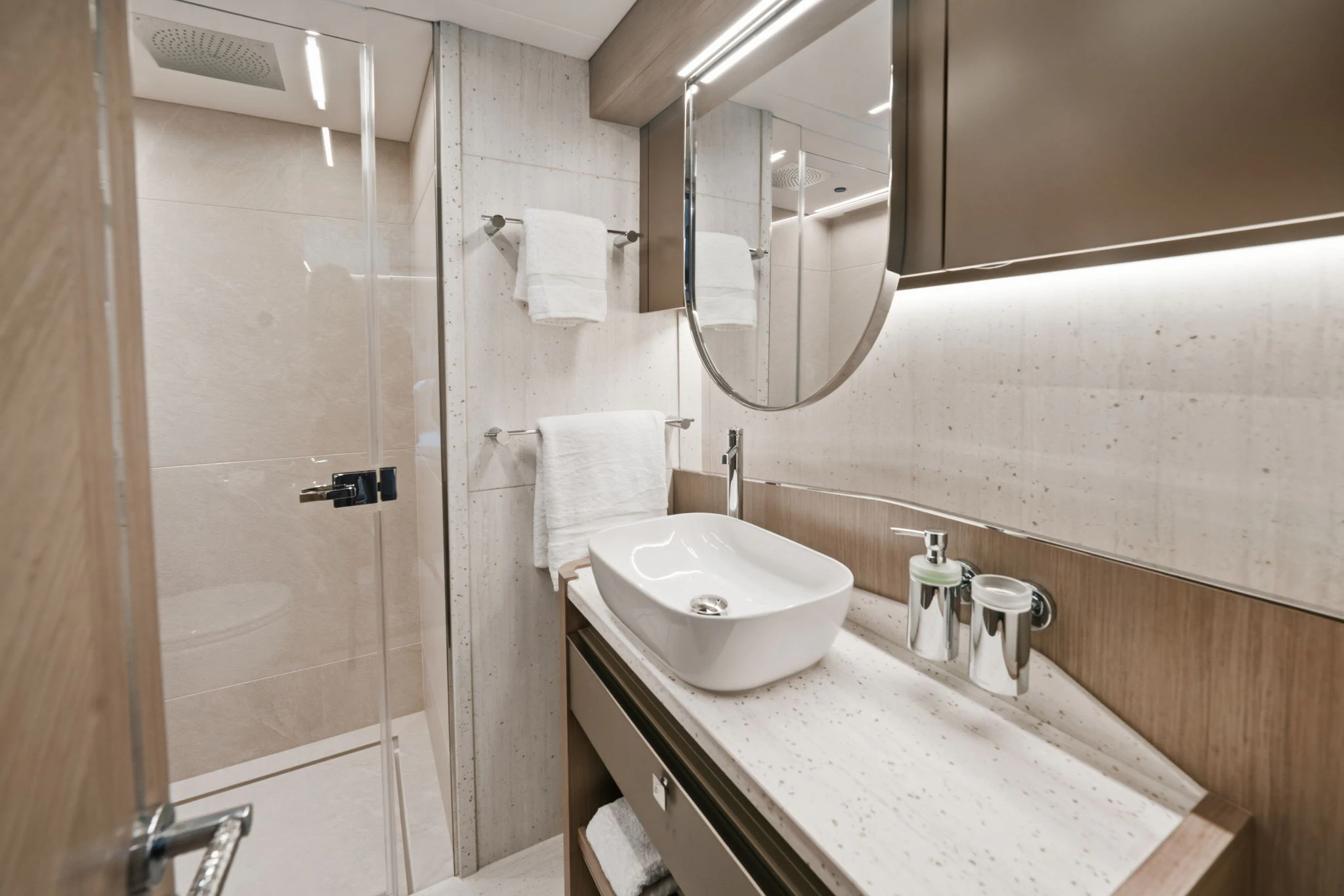 a bathroom with a sink and a shower aboard PURA VIDA Yacht for Sale