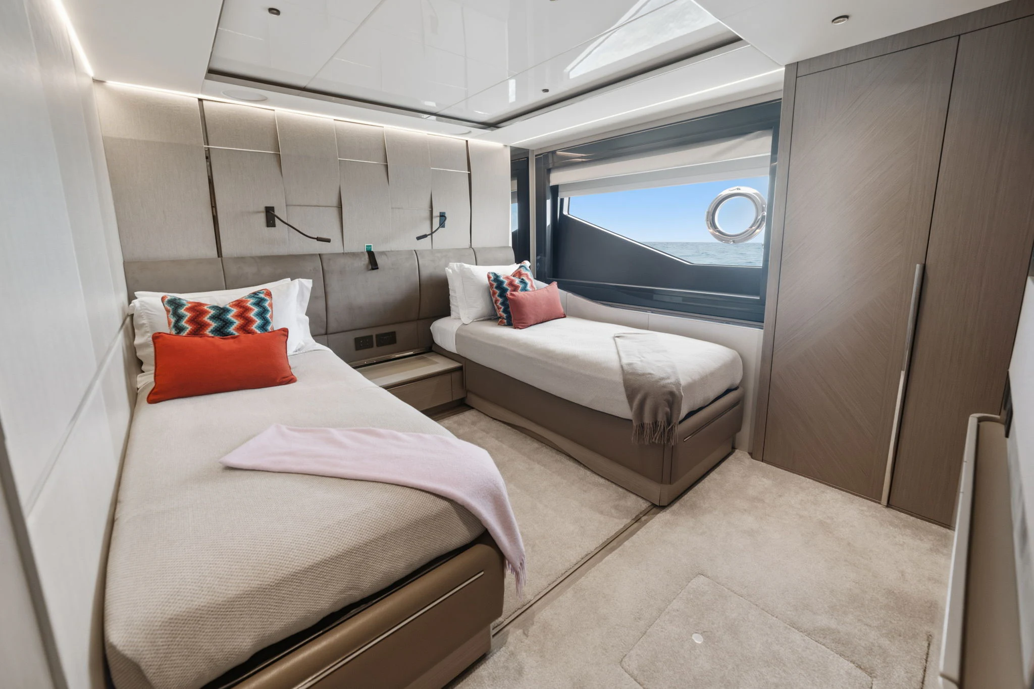 a room with two beds aboard PURA VIDA Yacht for Sale
