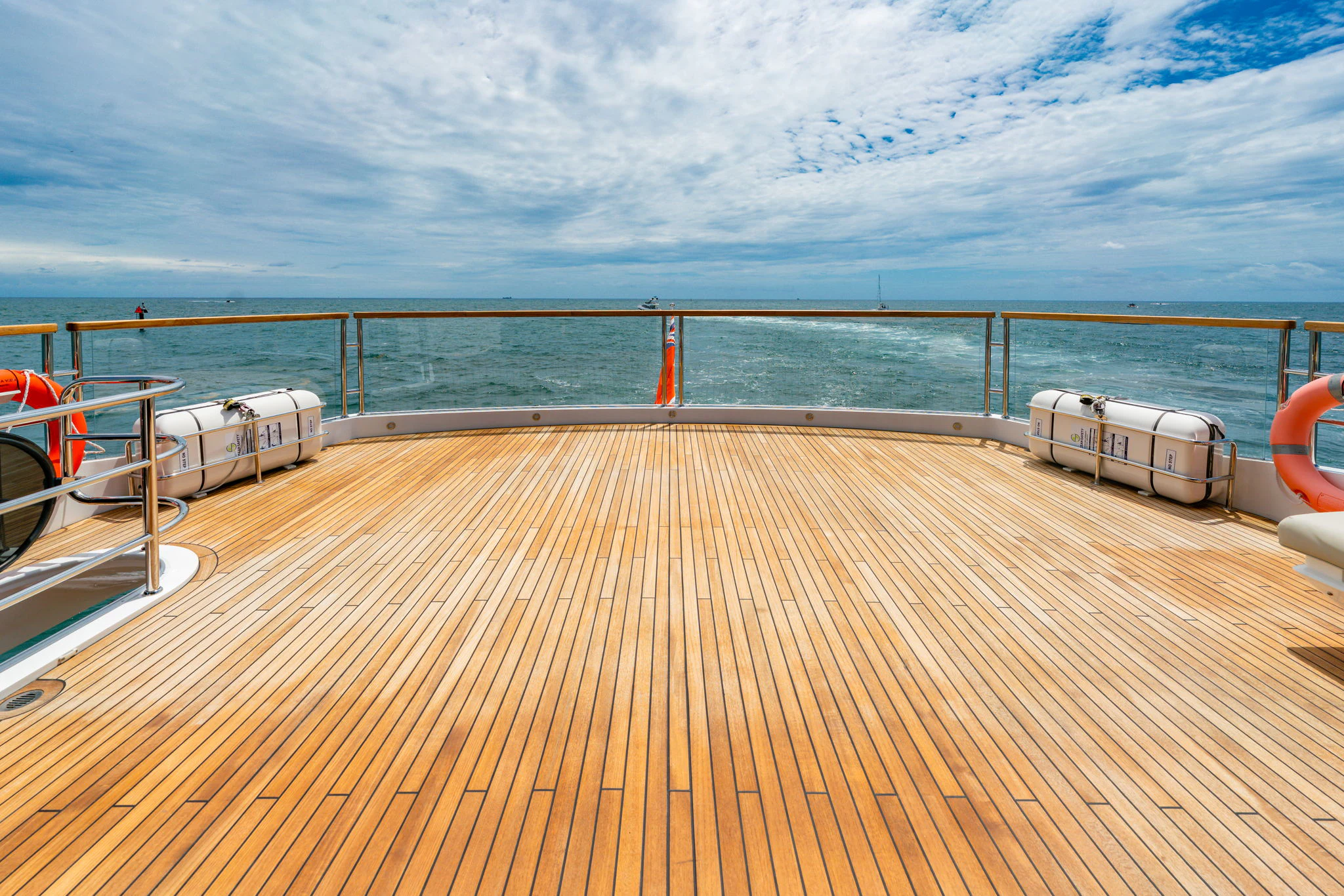 a wooden deck overlooking the ocean aboard PURA VIDA Yacht for Sale