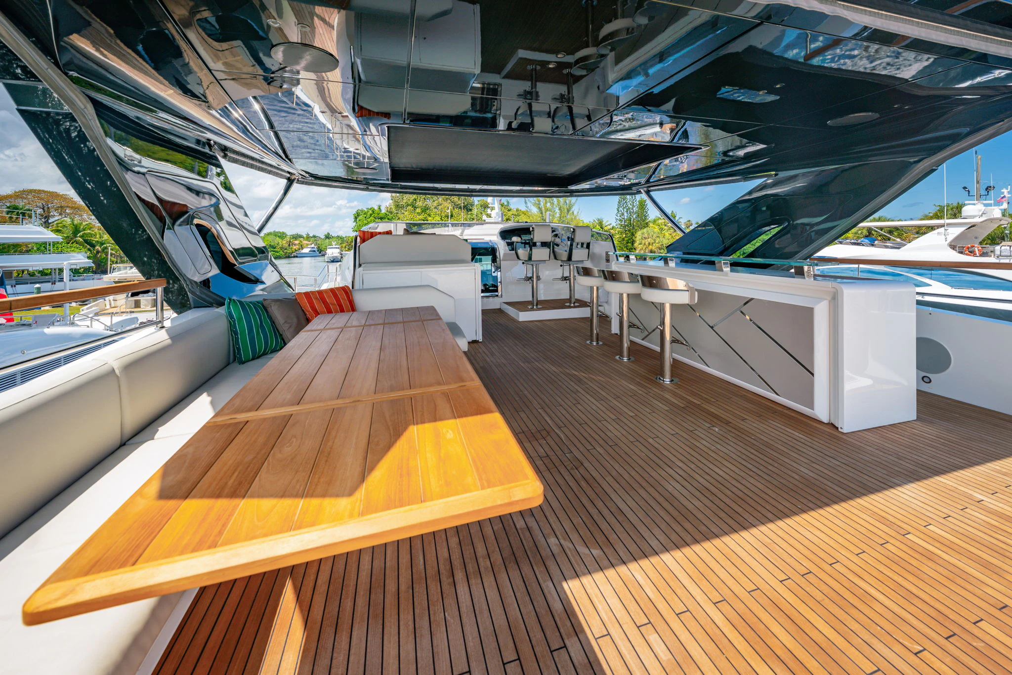 a deck with a deck and a pool aboard PURA VIDA Yacht for Sale