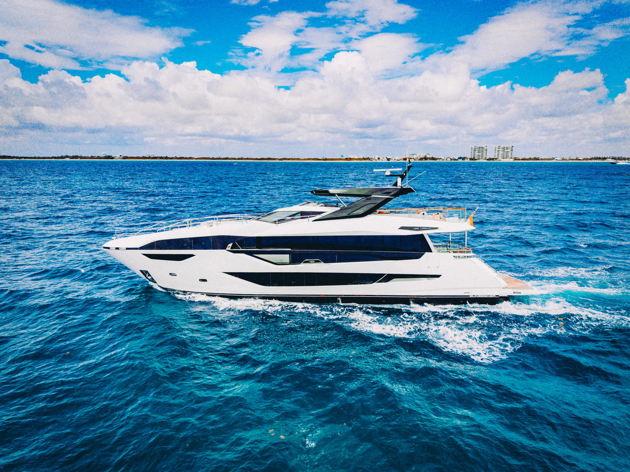 a white boat in the water aboard PURA VIDA Yacht for Sale