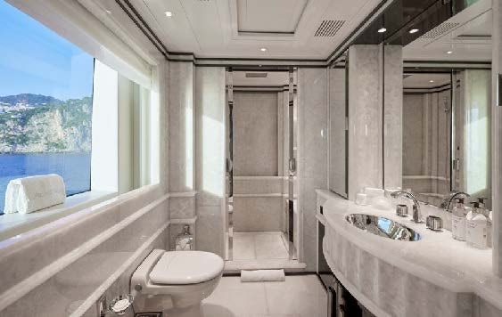 a bathroom with a tub sink and toilet aboard SILVER ANGEL Yacht for Charter