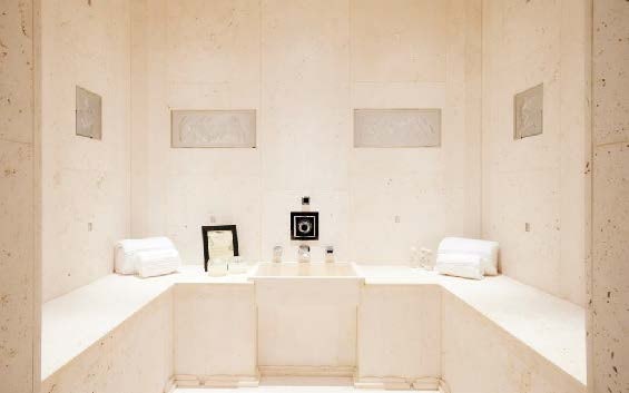 a bathroom with a tub and sinks aboard SILVER ANGEL Yacht for Charter