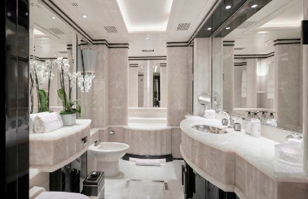 a bathroom with a sink toilet and bathtub aboard SILVER ANGEL Yacht for Charter