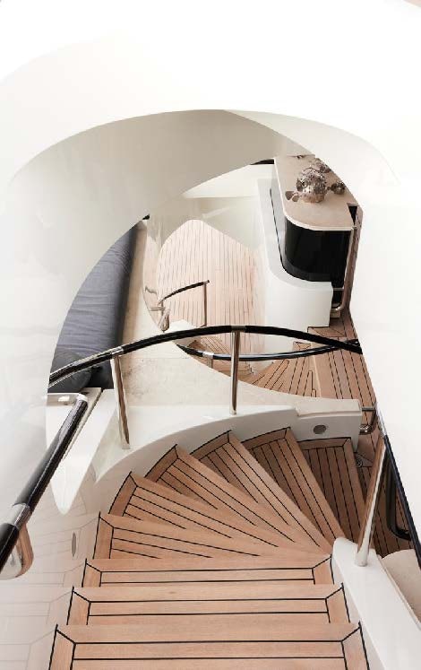 a spiral staircase with a white wall aboard SILVER ANGEL Yacht for Charter
