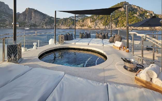 a swimming pool with a group of people in the background aboard SILVER ANGEL Yacht for Charter