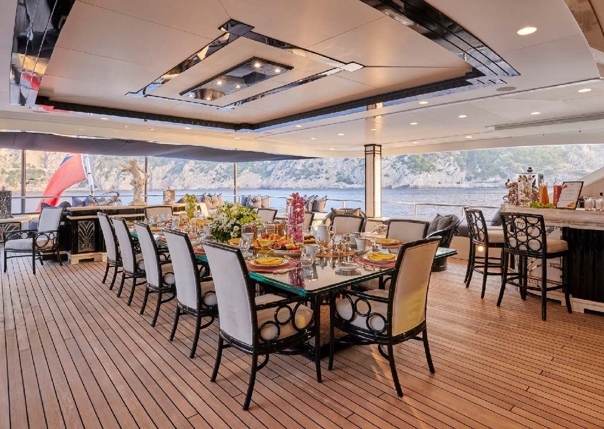 a dining room with a table and chairs aboard SILVER ANGEL Yacht for Charter