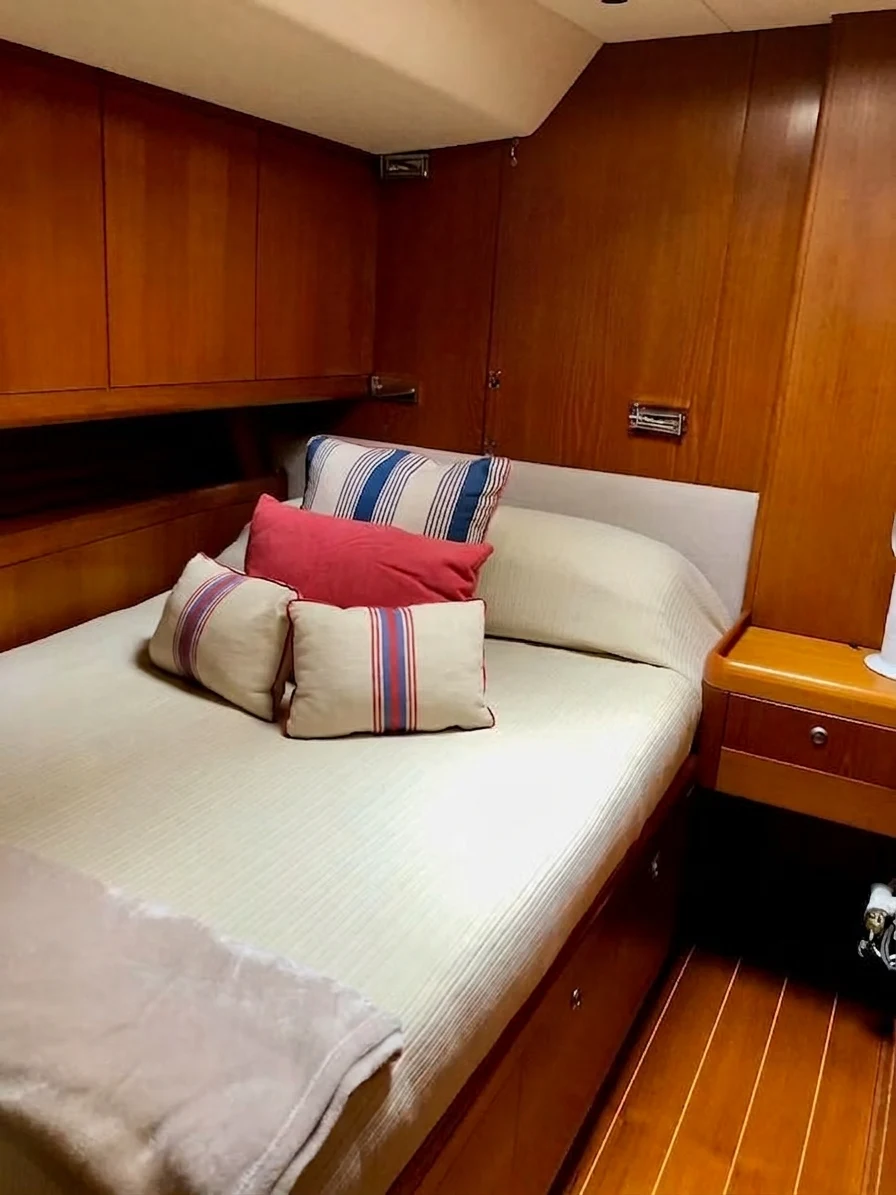 a bed with pillows aboard UNDERLORD Yacht for Sale